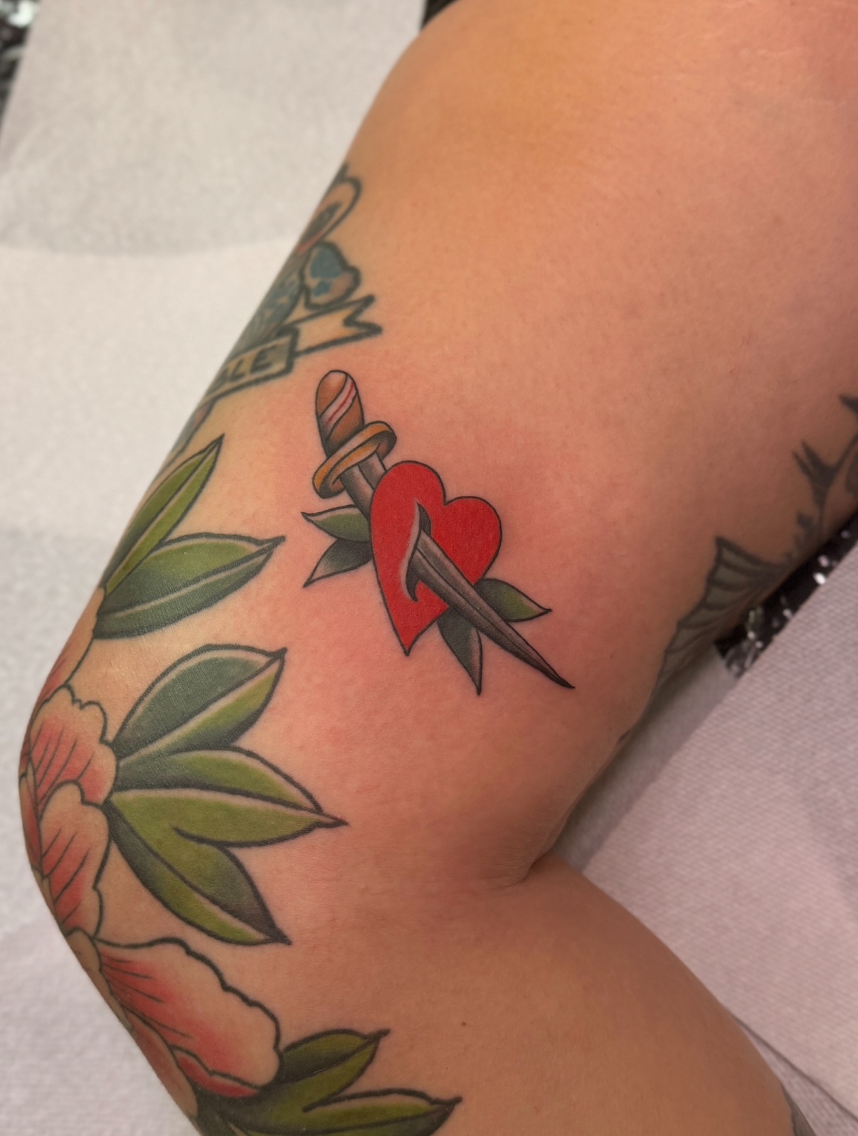 Heart pierced by dagger American traditional tattoo on the forearm by Ethan, Toledo, Ohio