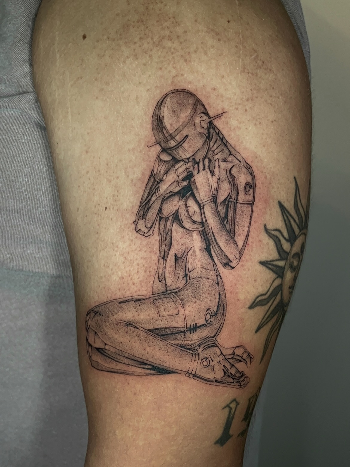 Robotic figure black and grey tattoo on the thigh by ♡ ant ☆