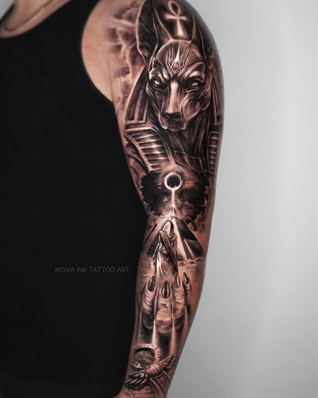 Anubis with Egyptian motifs realism tattoo on the forearm by Tattoo Artist Miami & la, Hollywood, Florida