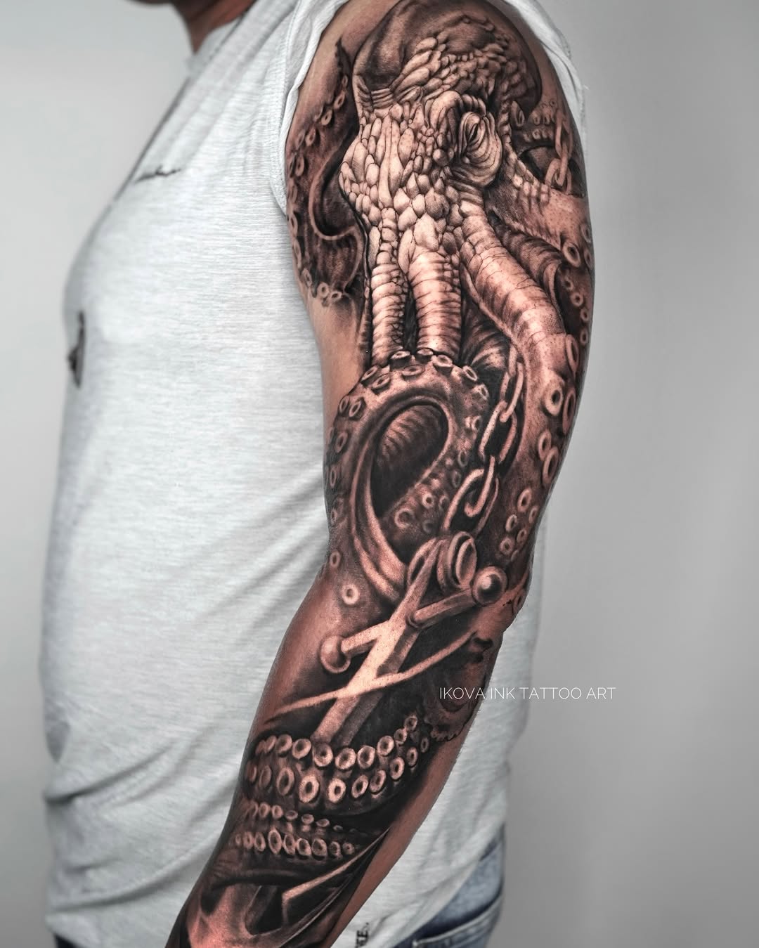 Octopus and chains realism tattoo on the forearm by Tattoo Artist Miami & la, Hollywood, Florida