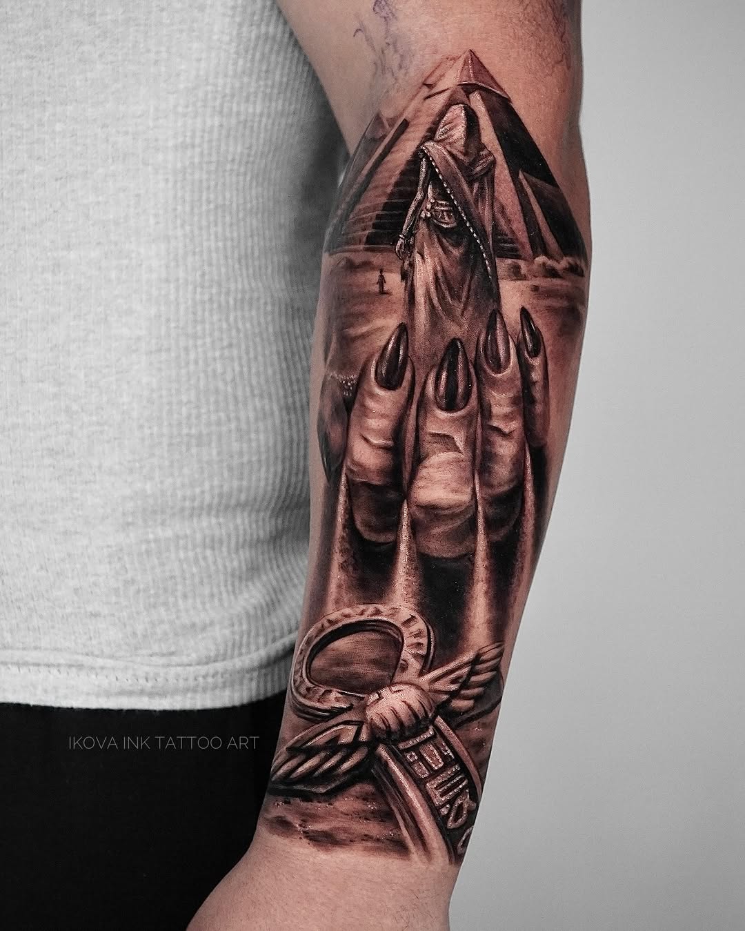 Egyptian pyramid, figure, and ankh realism tattoo on the forearm by Tattoo Artist Miami & la, Hollywood, Florida