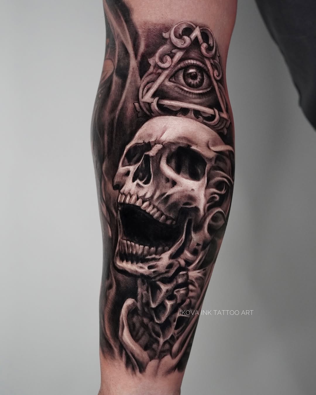 Skull and all-seeing eye realism tattoo on the forearm by Tattoo Artist Miami & la, Hollywood, Florida
