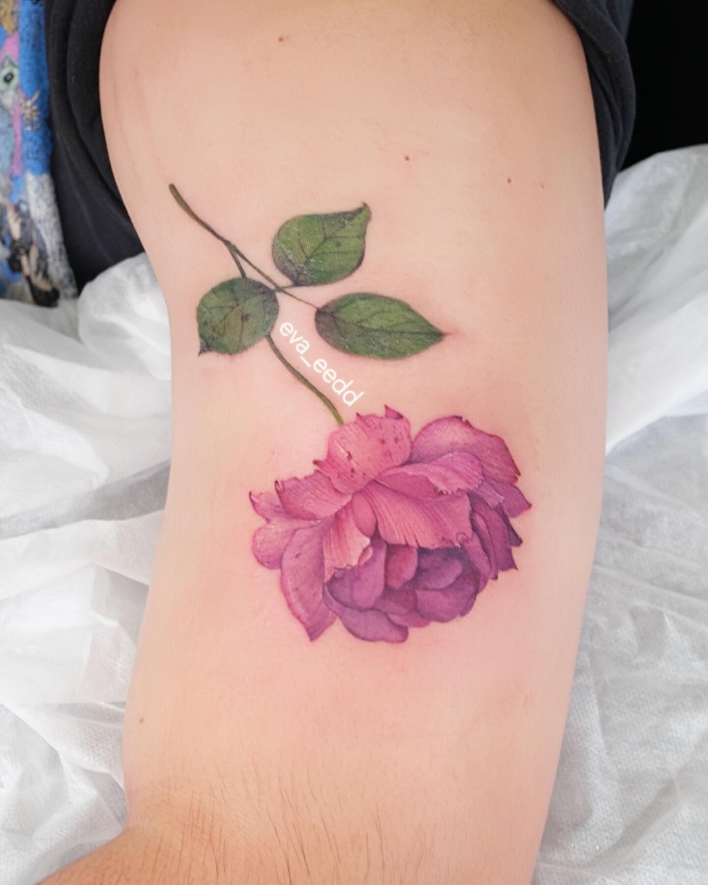 Rose realism tattoo on the forearm by Eva Liu
