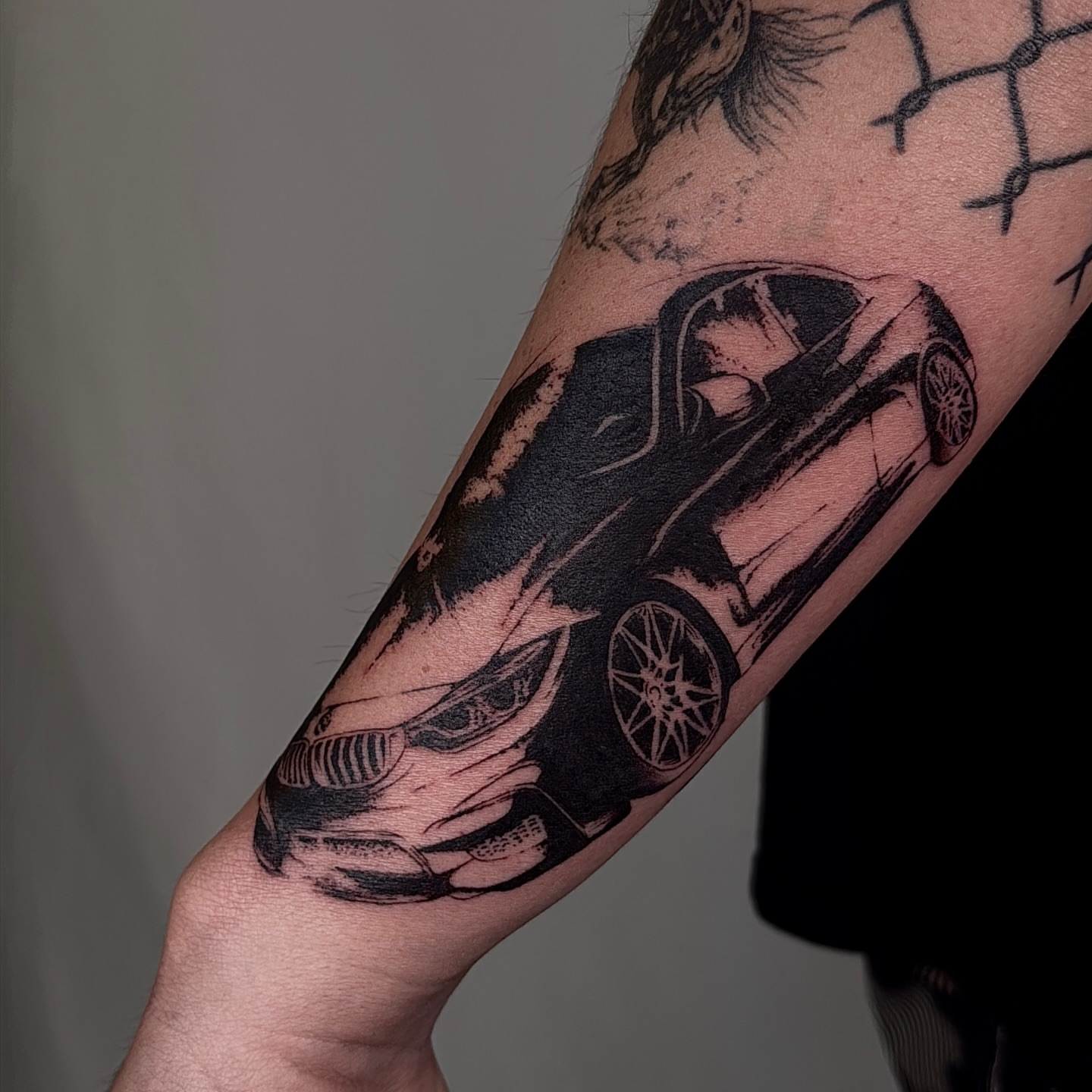 Car black and grey tattoo on the forearm by V เผ๏ธ ๐๐๐ญ๐ญ๐จ๐จ ๐๐ซ๐ญ๐ข๐ฌ๐ญ