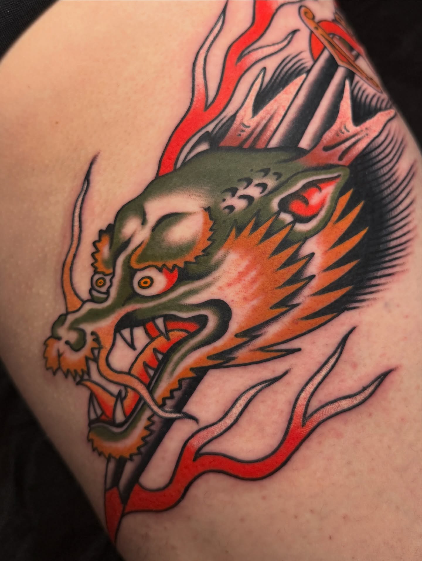 Dragon American traditional tattoo on the shoulder by Chaz Otto