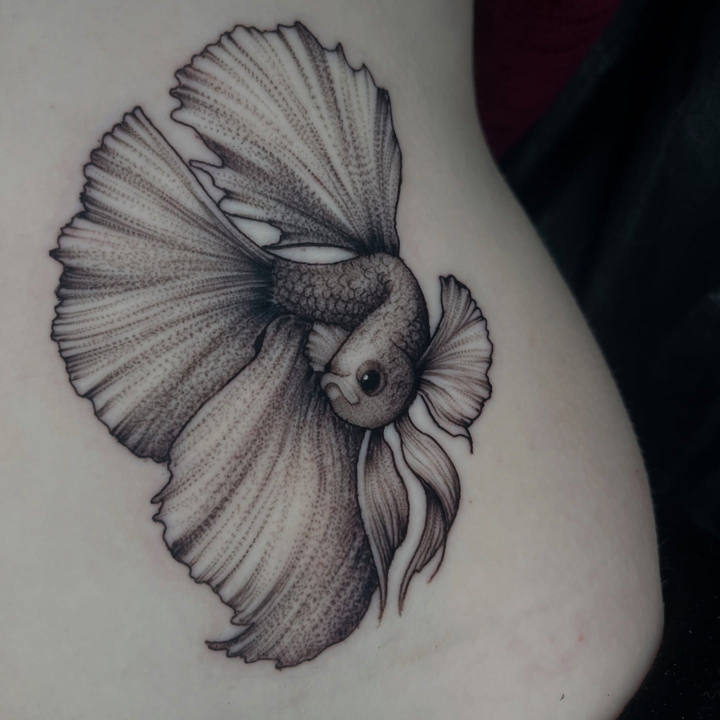 Goldfish black and grey tattoo on the thigh by Jordan Hunt