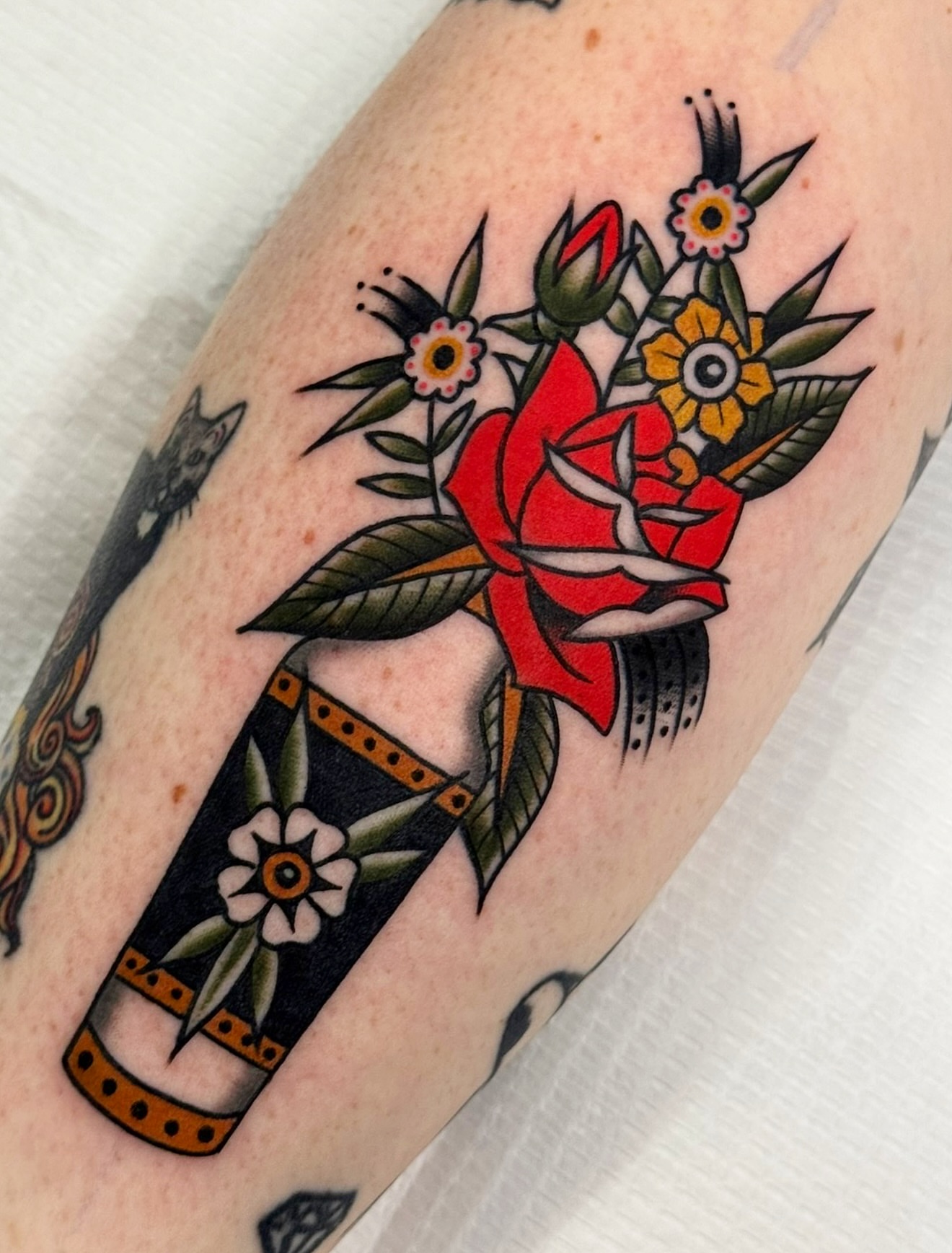 Flower bouquet American traditional tattoo on the forearm by Cory Craft