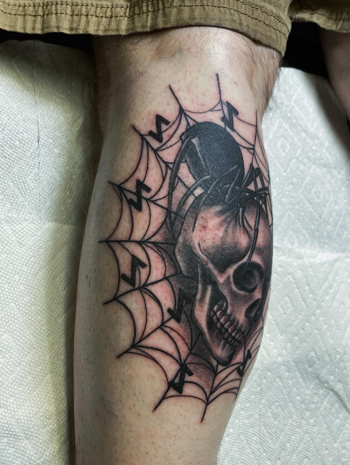 Skull and spider realism tattoo on the forearm by Houston tattoo artist
