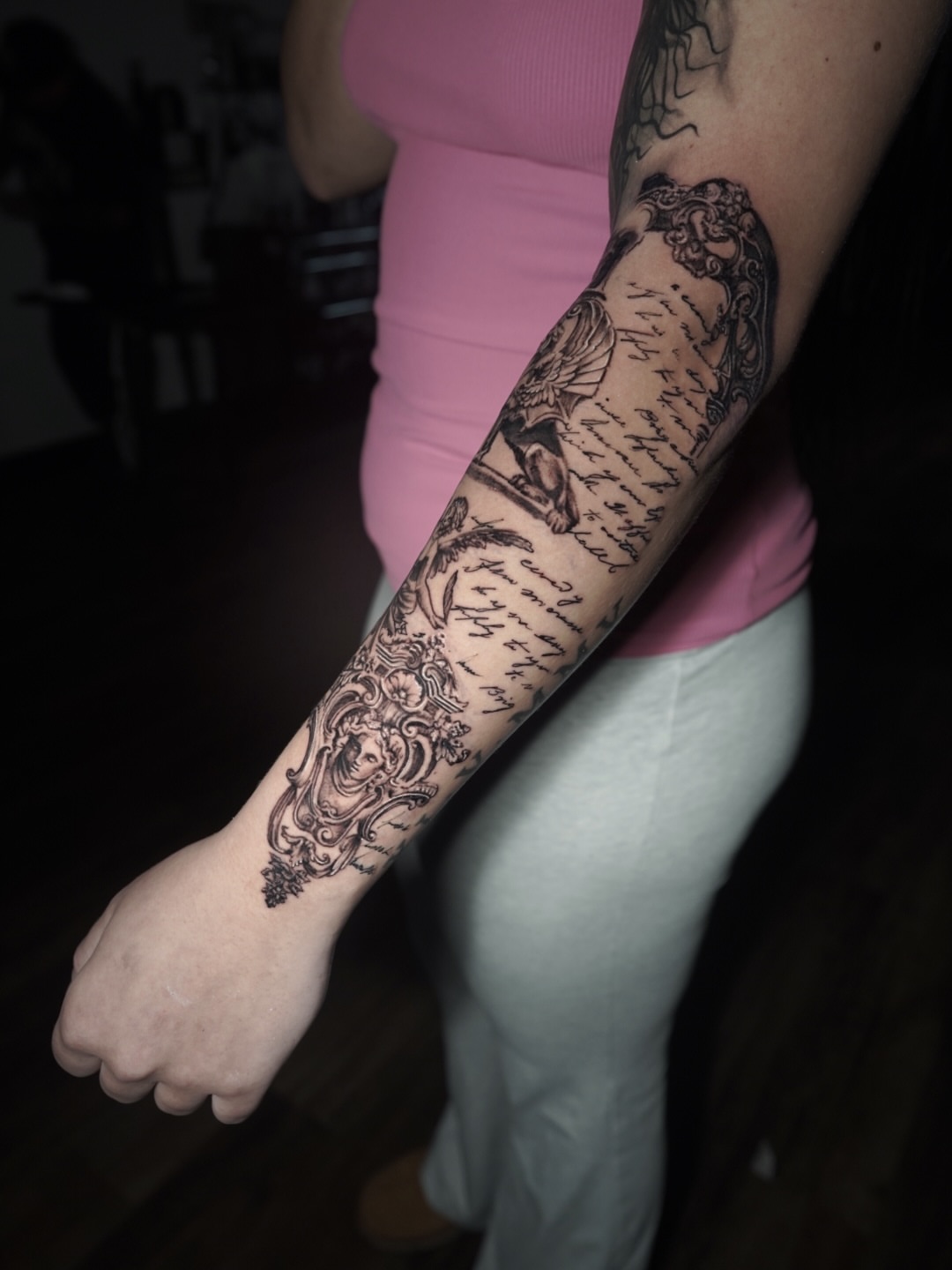 Script lettering black and grey tattoo on the forearm by Niko Hosk Cataldo