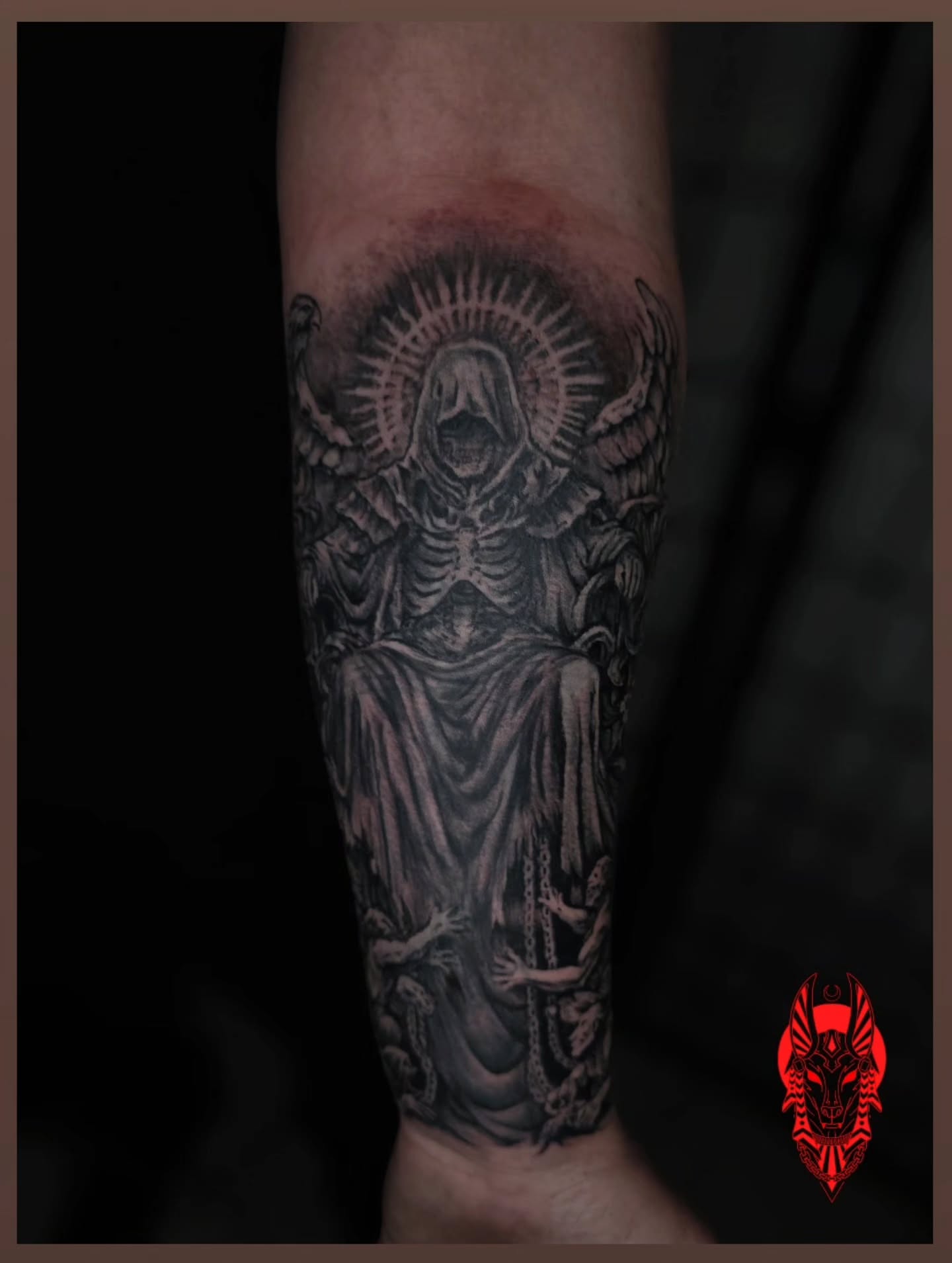 Skeleton with halo realism tattoo on the forearm by Bry True