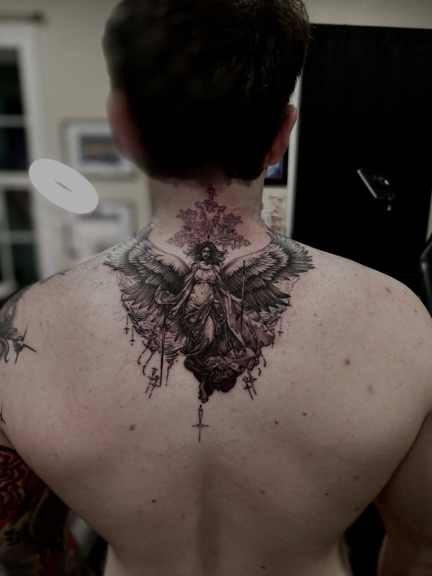 Angelic figure realism tattoo on the back by Alberto M