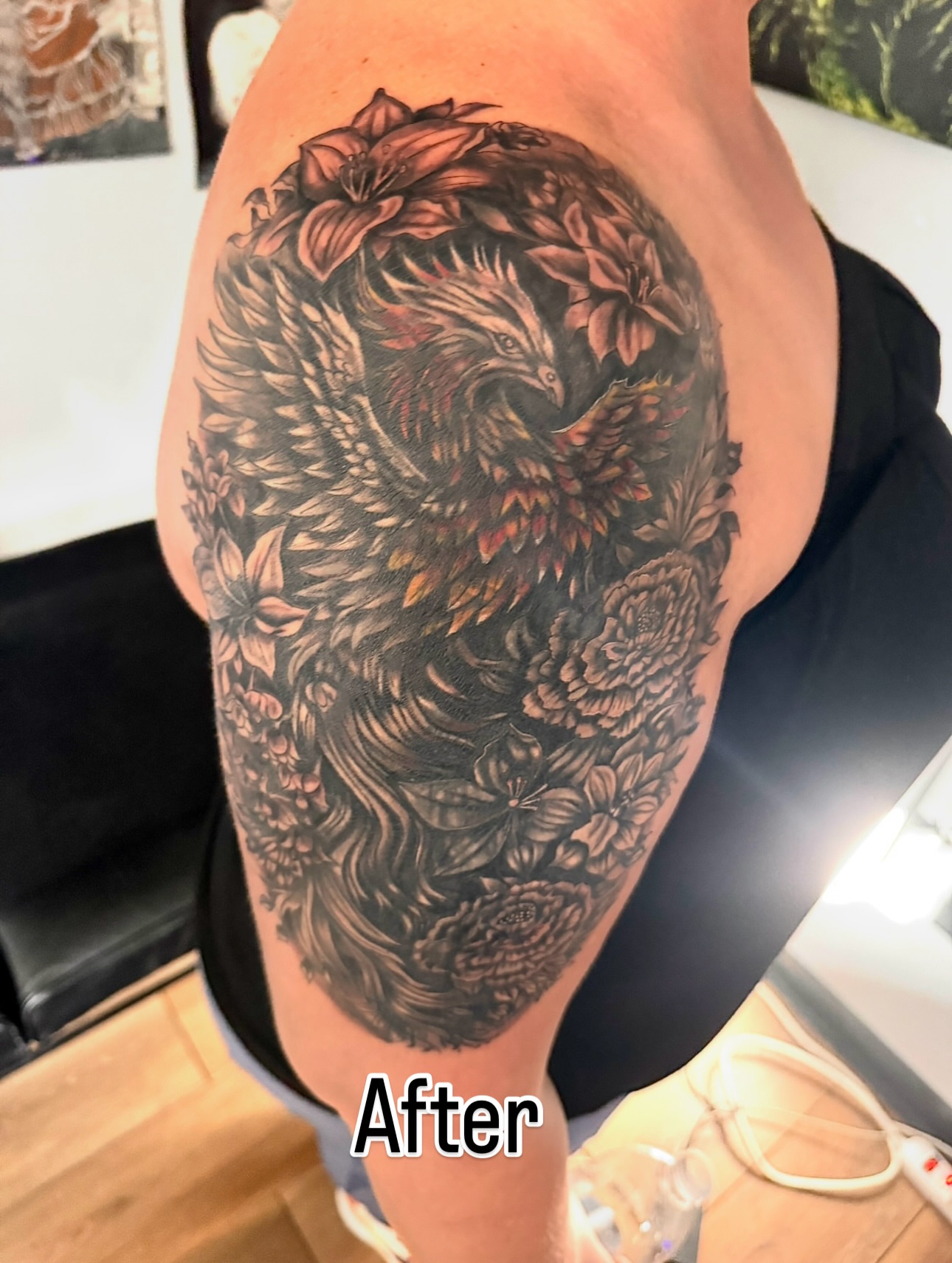Floral phoenix realism tattoo on the upper arm by Tampa tattoo artist