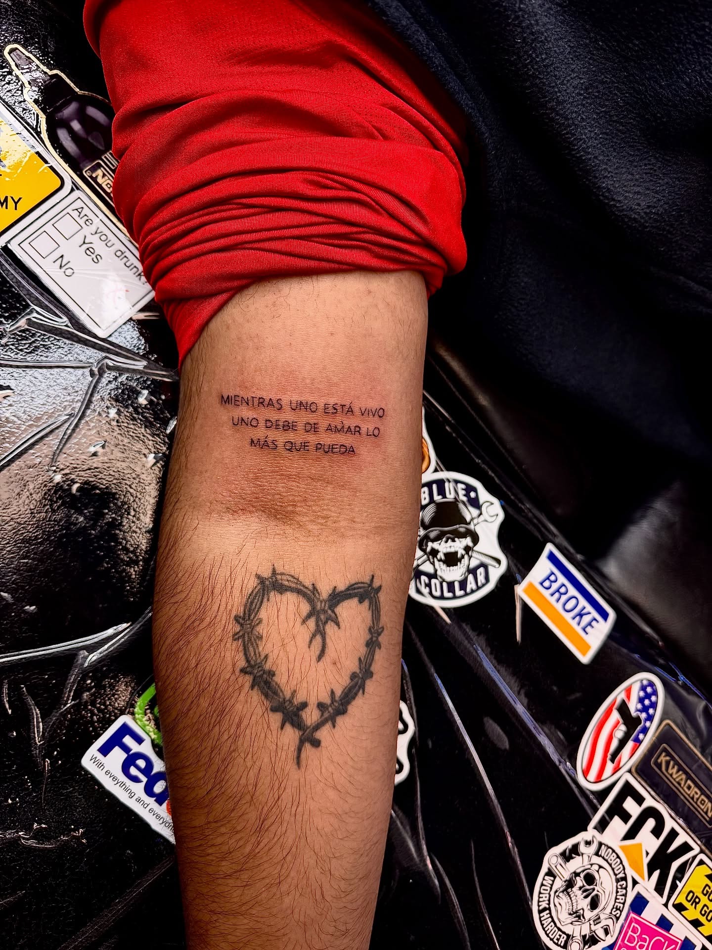 Heart with barbed wire black and grey tattoo on the forearm by Tampa tattoo artist