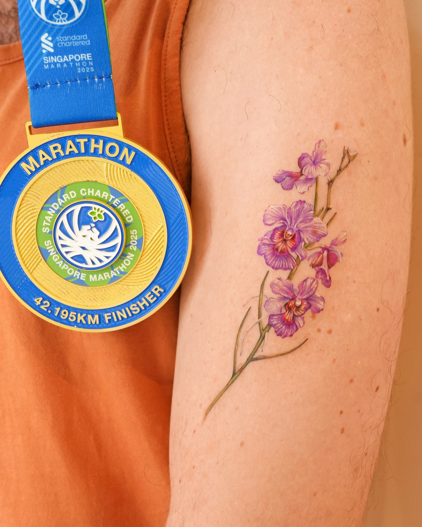 Orchids watercolor tattoo on the forearm by YUN