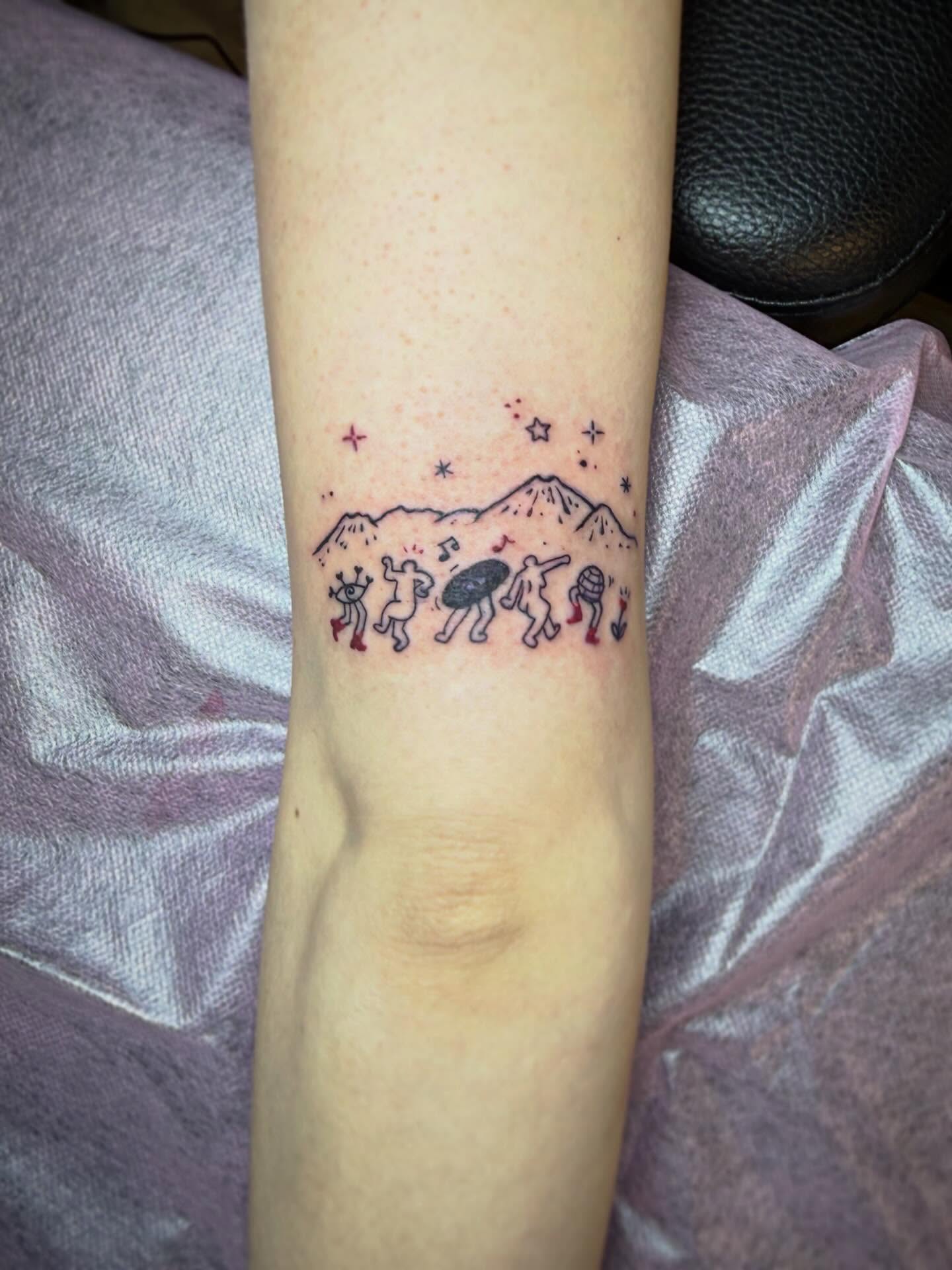 Astronauts and mountains dotwork tattoo on the forearm by Taytum Marsing, Salt Lake City, Utah