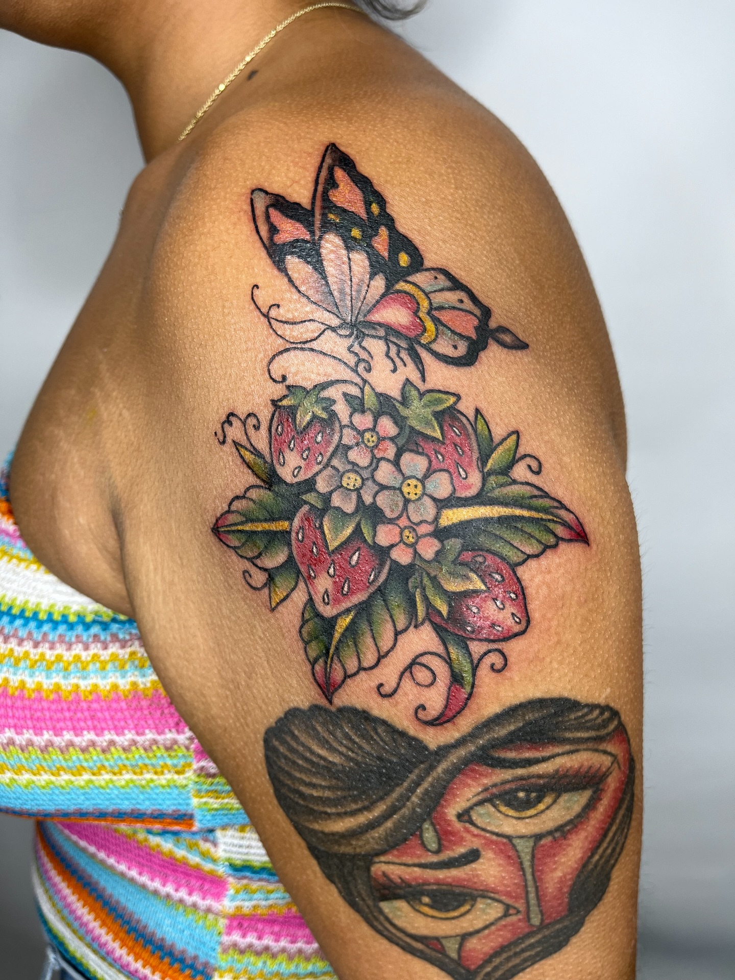 Butterfly and strawberries American traditional tattoo on the shoulder by ✨ Chris ✨