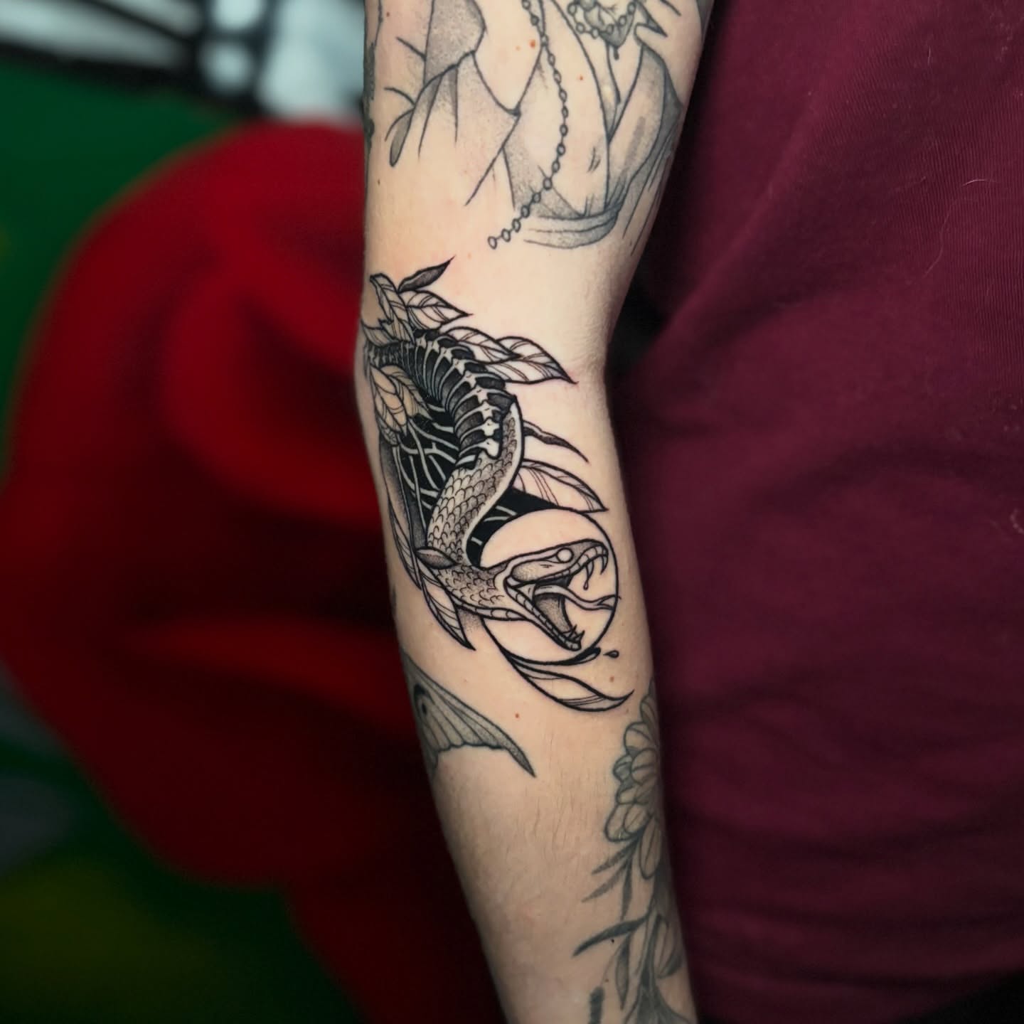 Snake and leaves black and grey tattoo on the forearm by 𝕊𝕒𝕞 ☪︎ ִ ࣪𖤐 𐦍 ☾𖤓