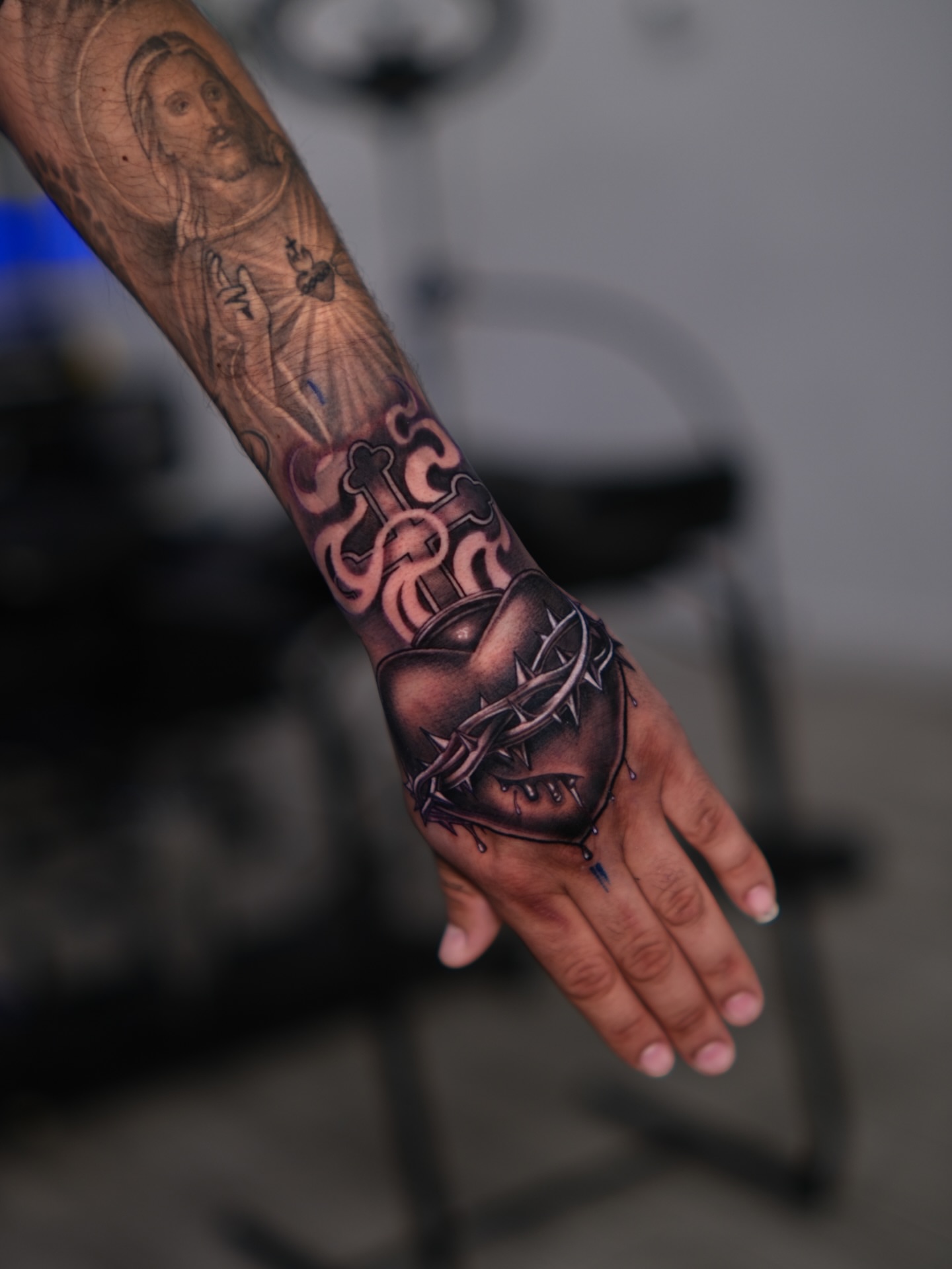 Religious imagery realism tattoo on the forearm by Dallas tattoo artist