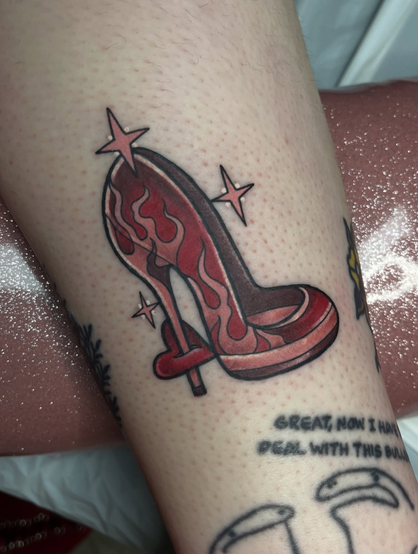 High heel shoe American traditional tattoo on the forearm by Michigan Tattoo Artist - Nadia Garver, Clinton Township, Michigan