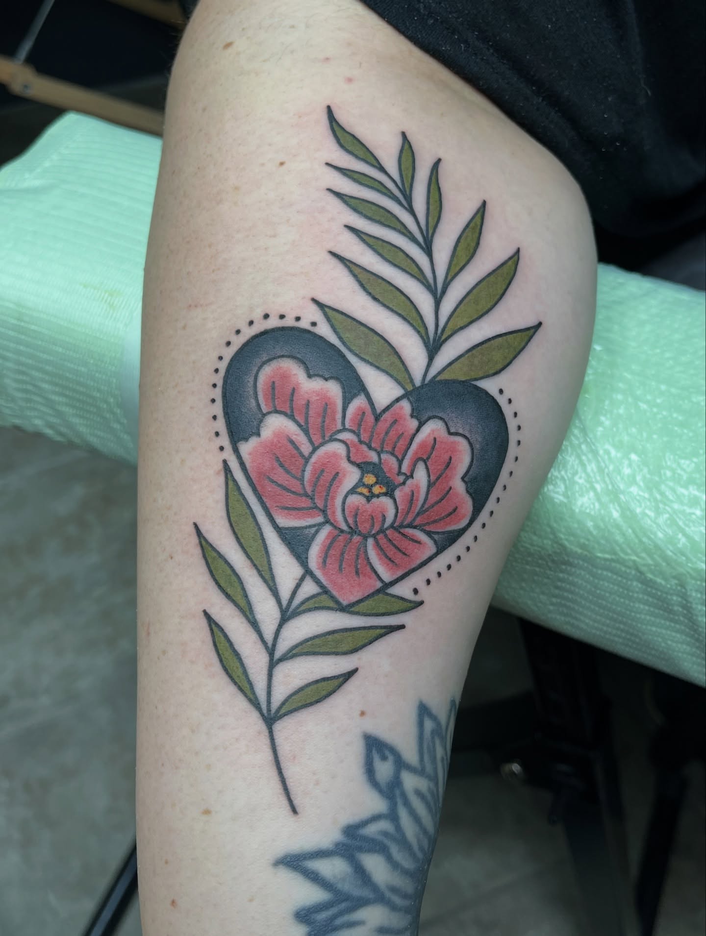 Flower heart American traditional tattoo on the thigh by Michigan Tattoo Artist - Nadia Garver, Clinton Township, Michigan