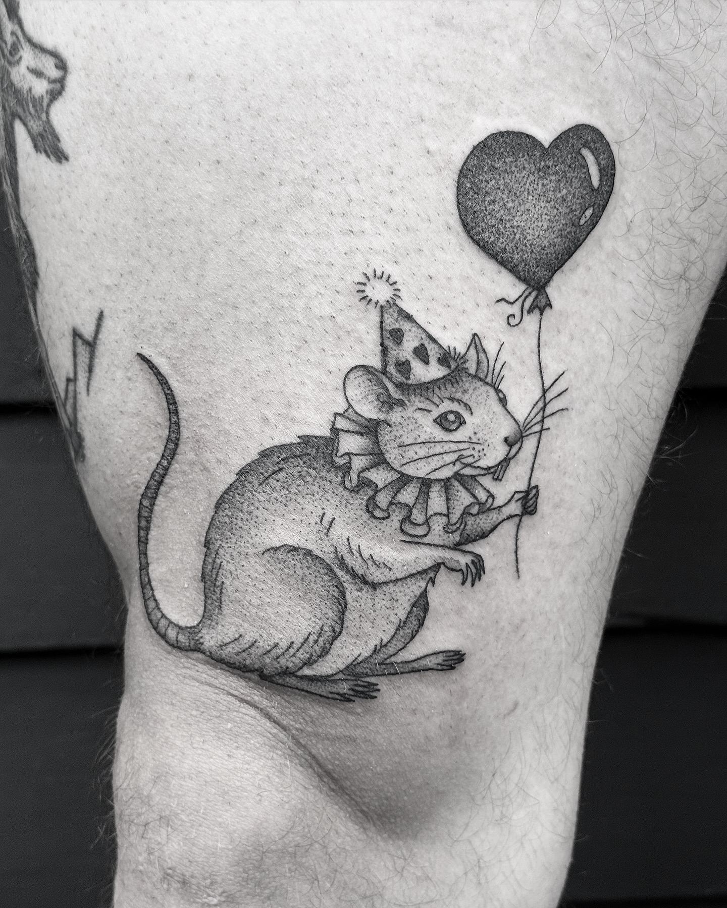 Mouse with balloon dotwork tattoo on the forearm by Breezy Tucker