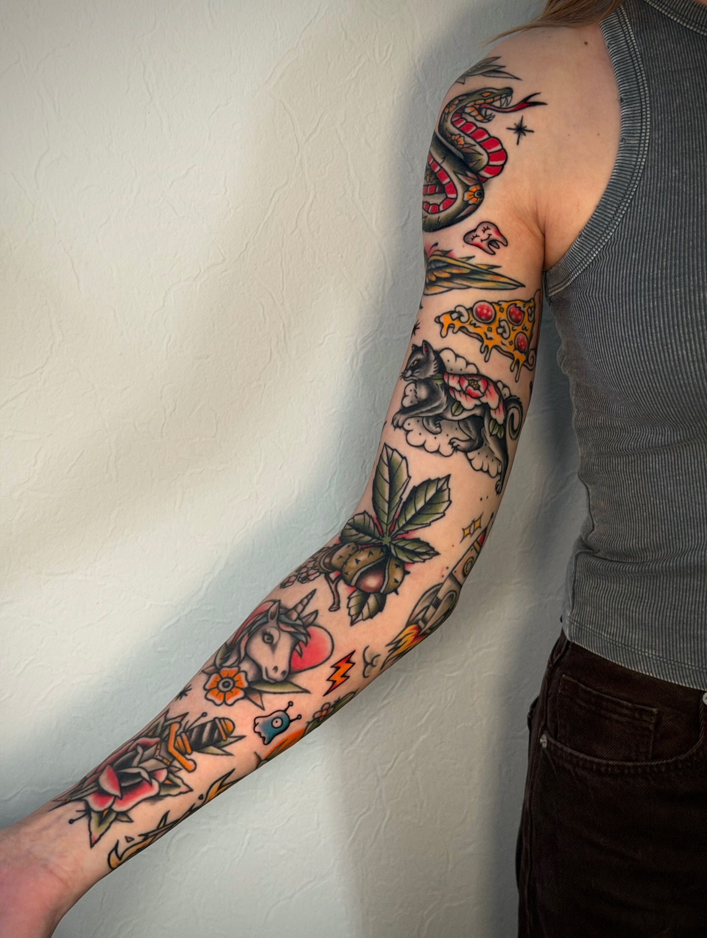 Pizza slice American traditional tattoo on the forearm by Black and color tattoo!