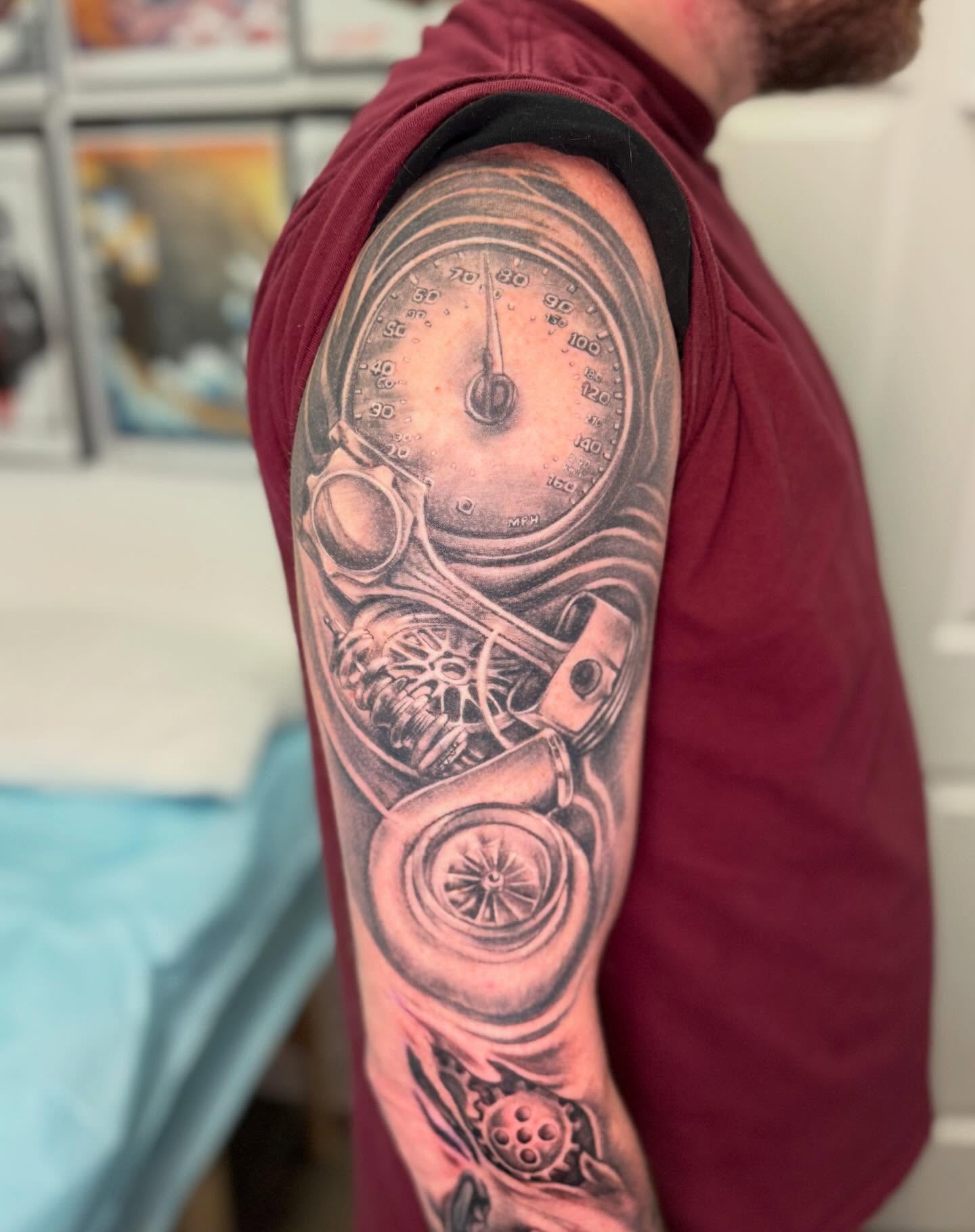 Speedometer and engine components realism tattoo on the upper arm by Vega