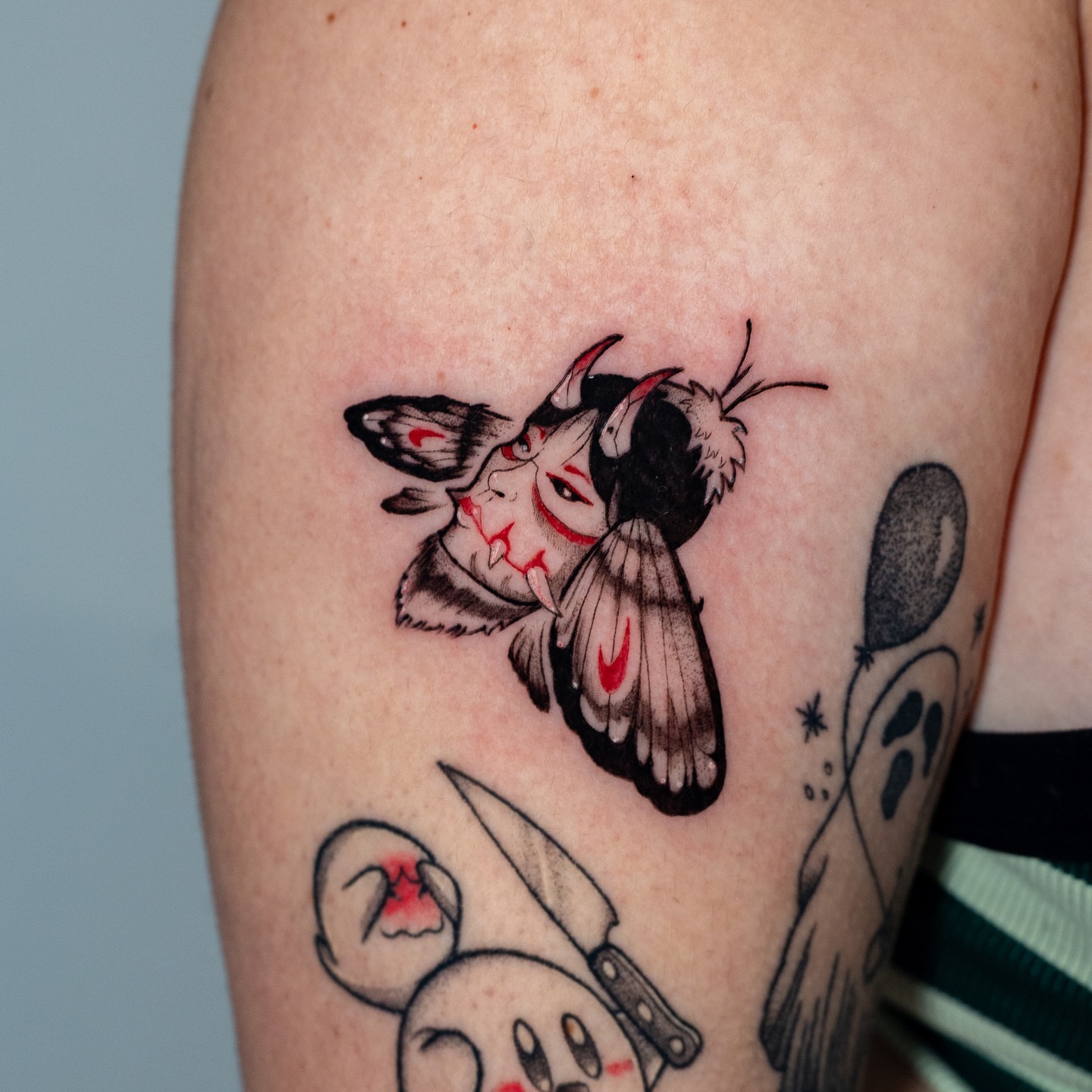Cow moth anime tattoo on the forearm by Kalin, Seattle, Washington