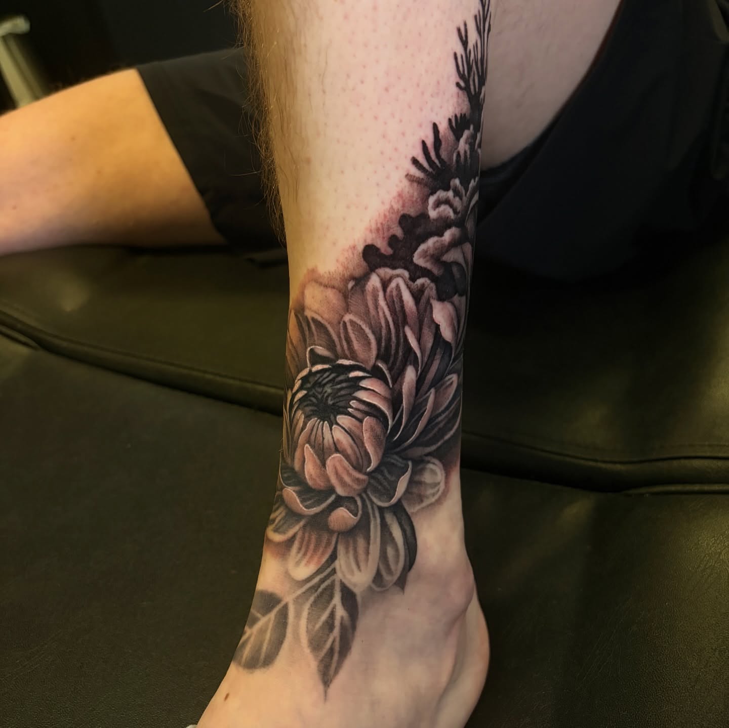 Chrysanthemum realism tattoo on the forearm by Zachary Hayden