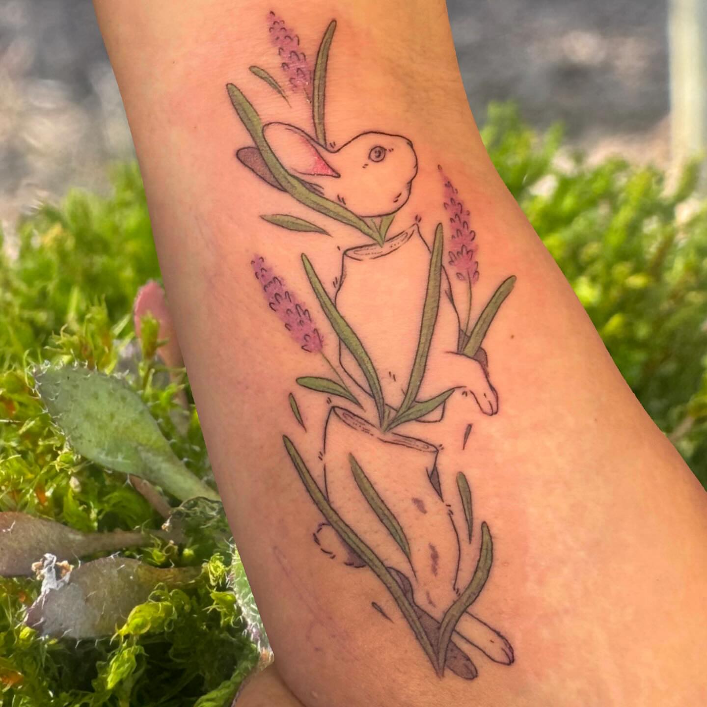 Rabbit and lavender illustrative tattoo on the forearm by Ivy
