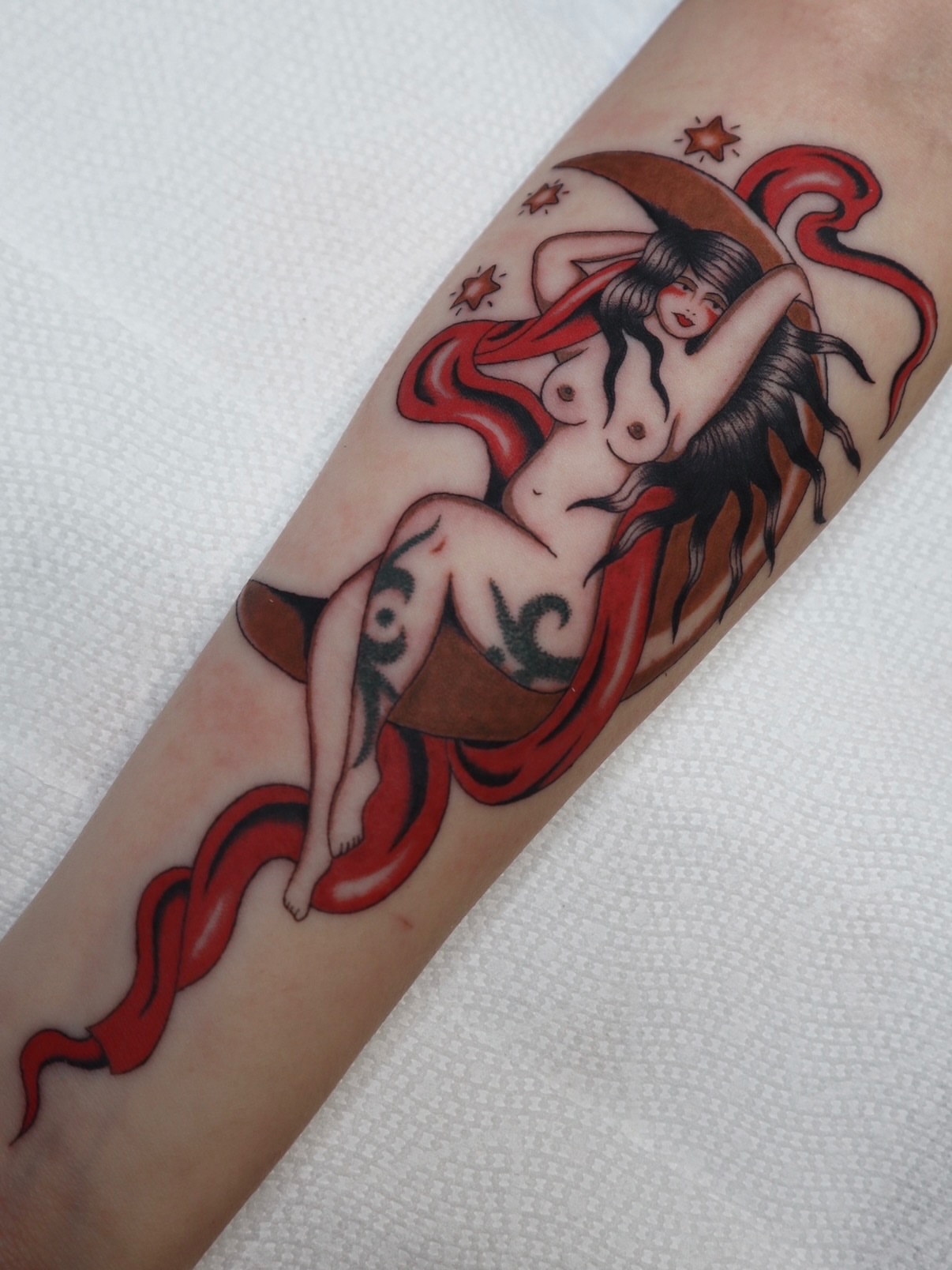 Mermaid American traditional tattoo on the forearm by Kate Ortiz