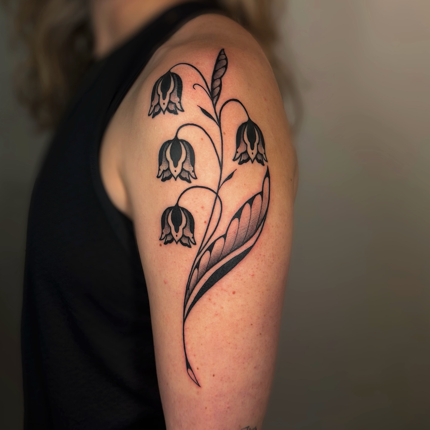 Bell flowers black and grey tattoo on the shoulder by Kail