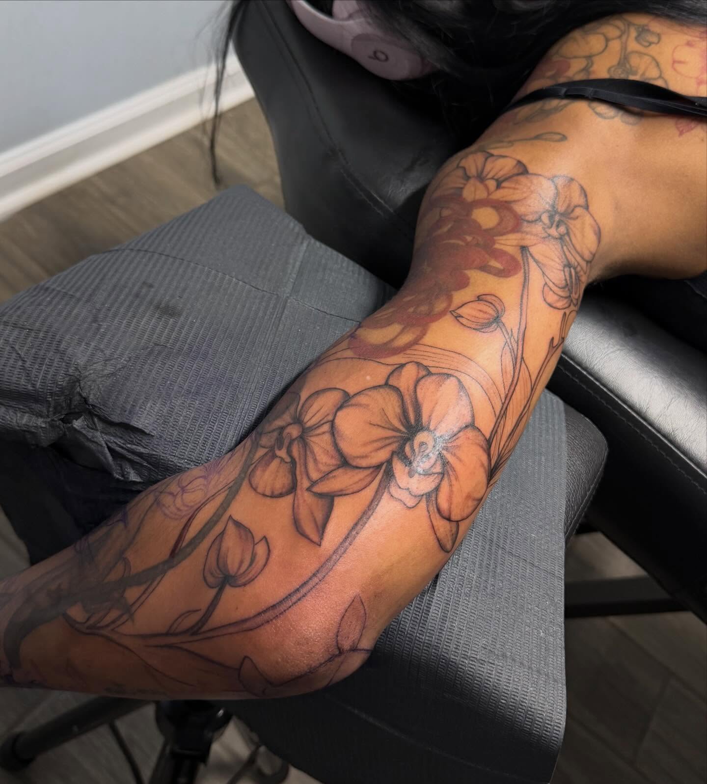 Floral arrangement black and grey tattoo on the forearm by Stephania ATLANTA TATTOO ARTIST🎨