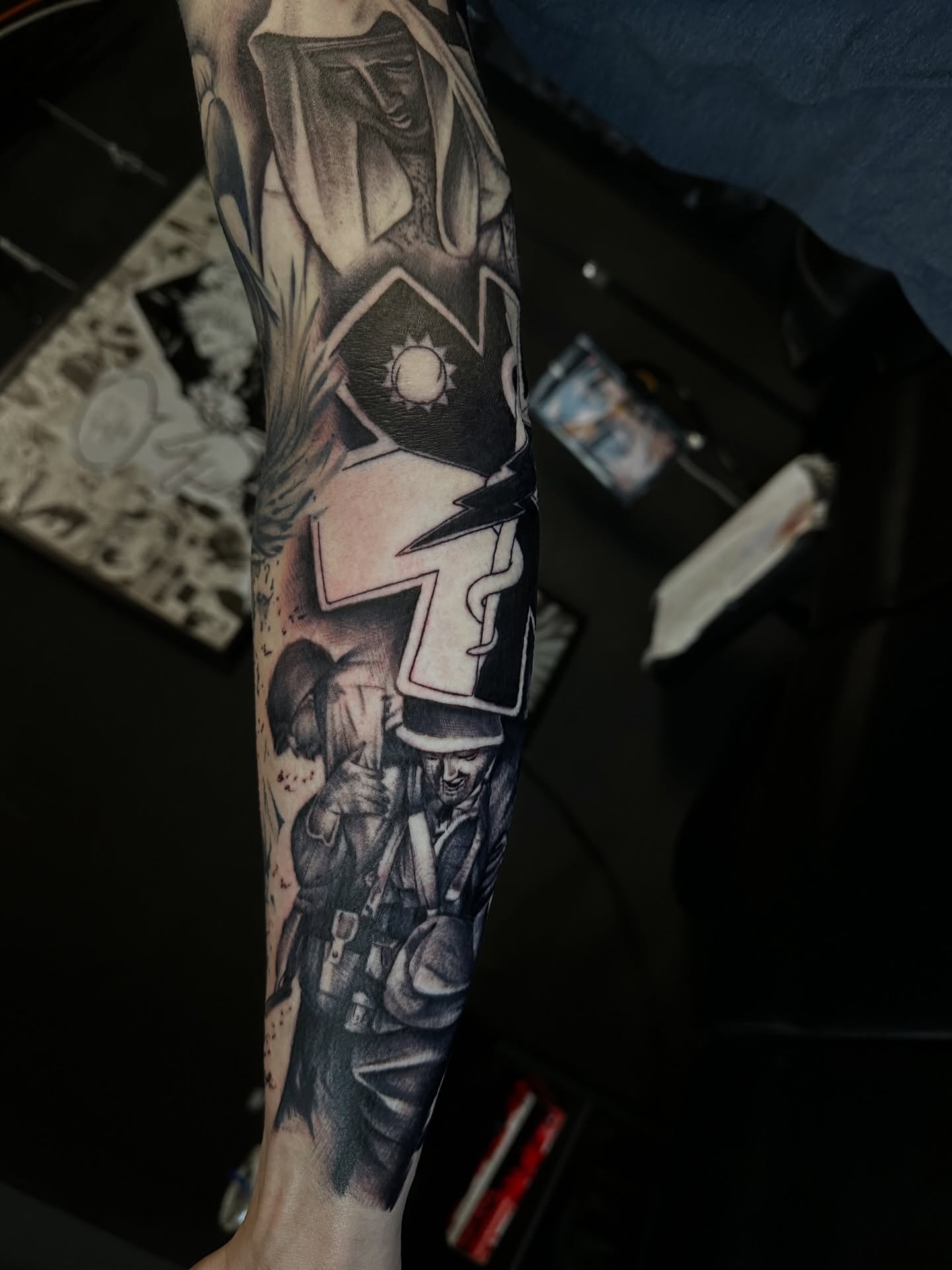 Military-themed artwork realism tattoo on the forearm by Angel Tattoos