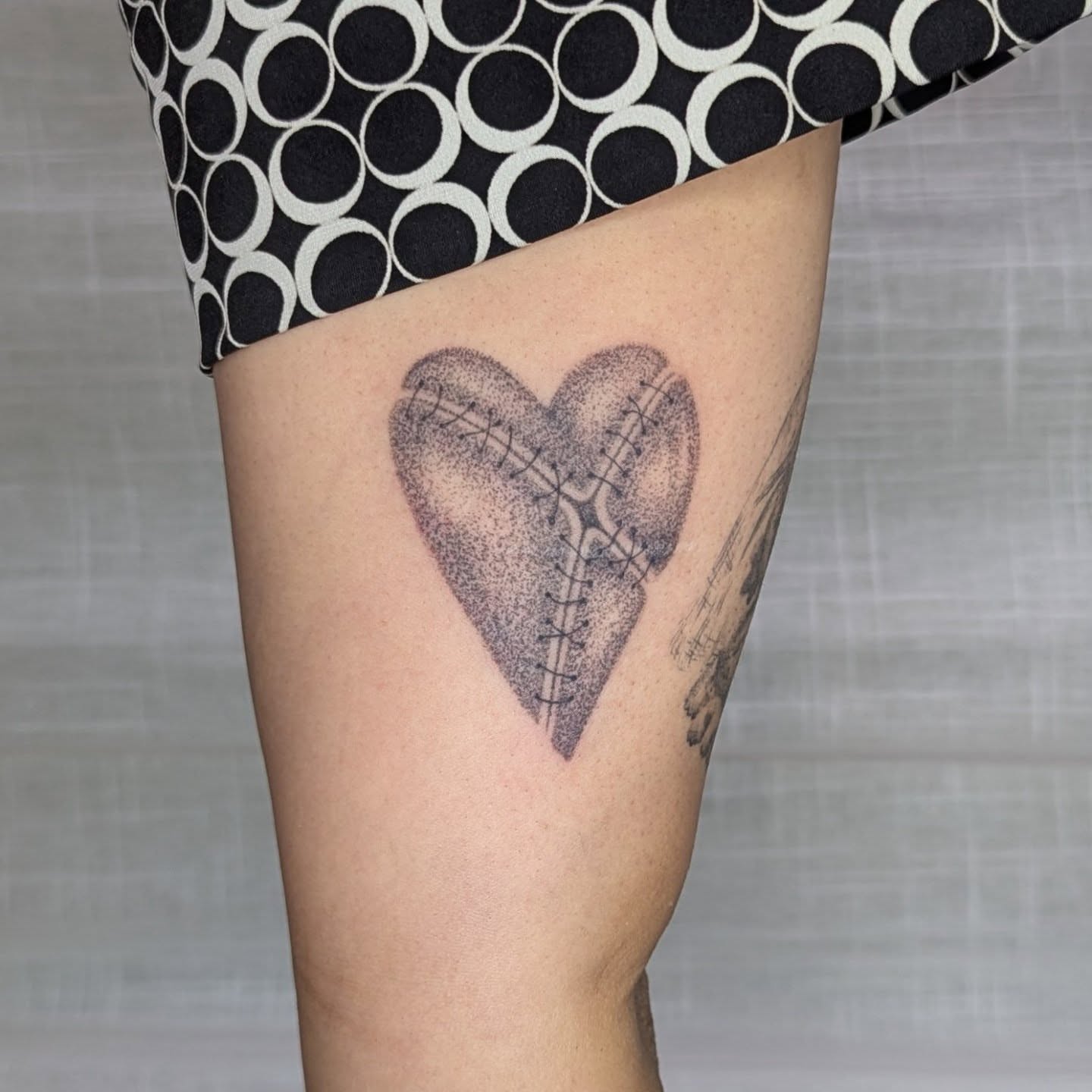 Heart dotwork tattoo on the thigh by theo, Portland, Oregon