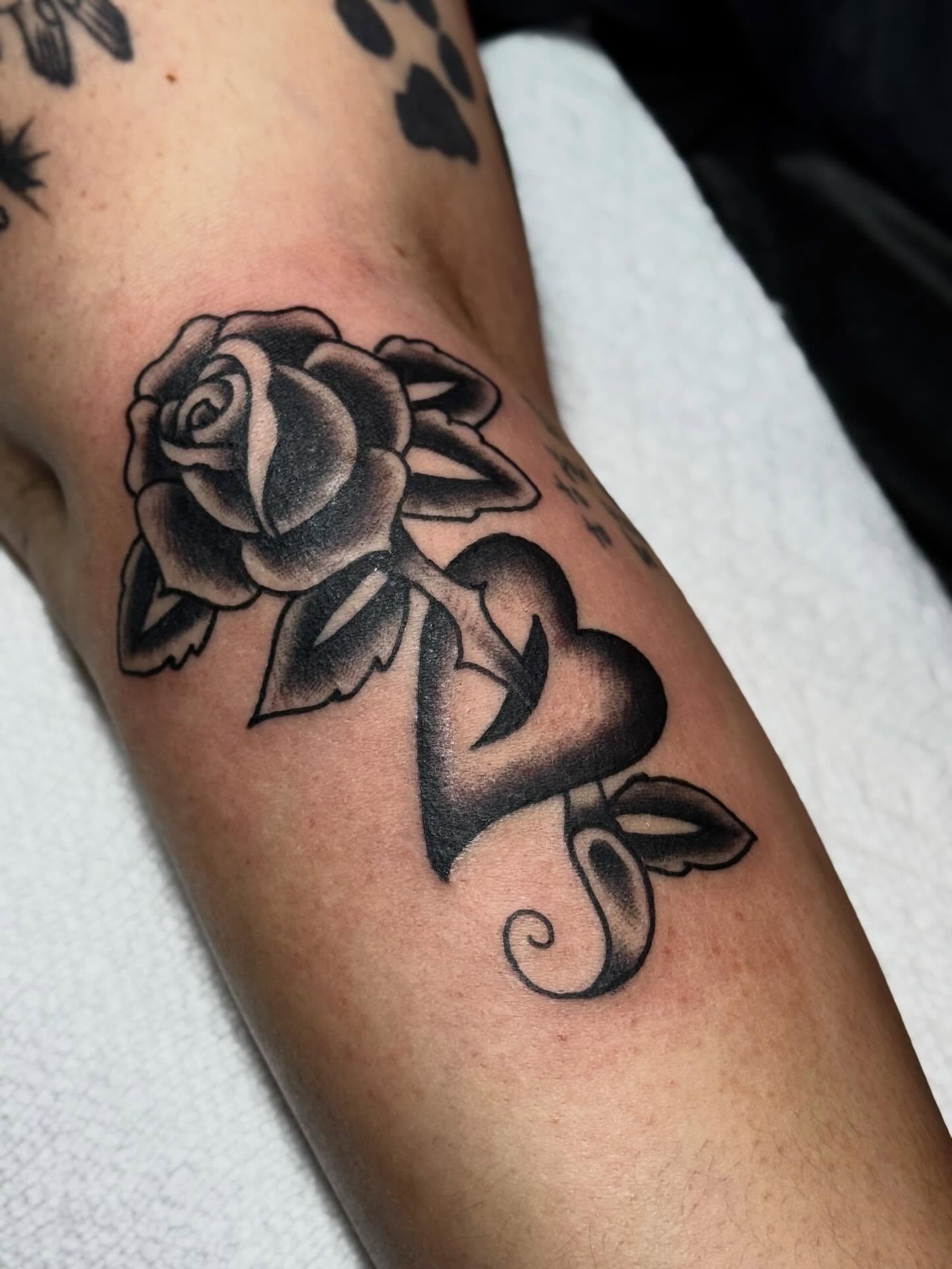 Rose black and grey tattoo on the forearm by Meg Nefcy, Milford, Michigan