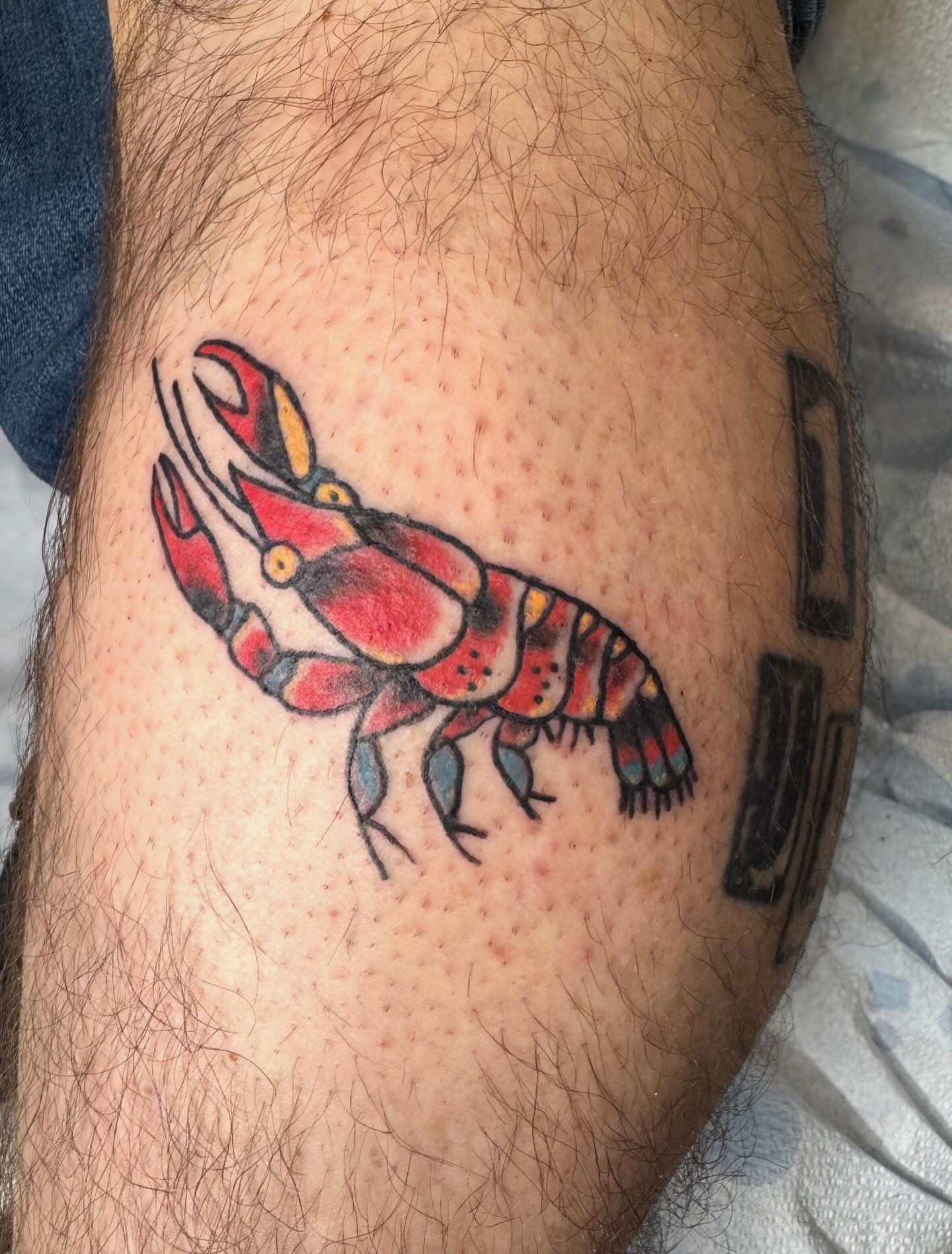 Lobster American traditional tattoo on the thigh by @brocks_tatt_attic_, New Orleans, Louisiana
