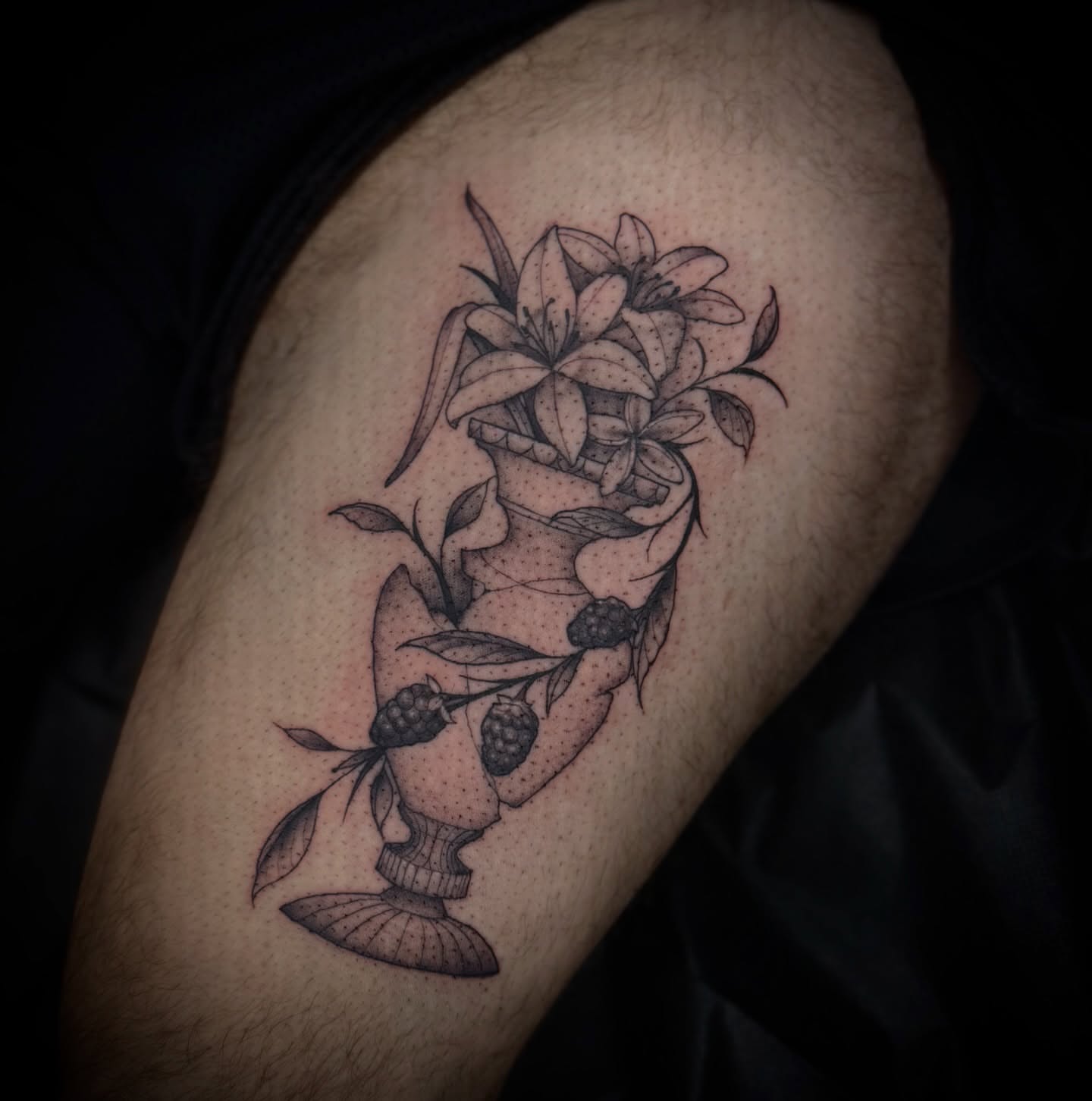 Floral arrangement dotwork tattoo on the thigh by Marcus