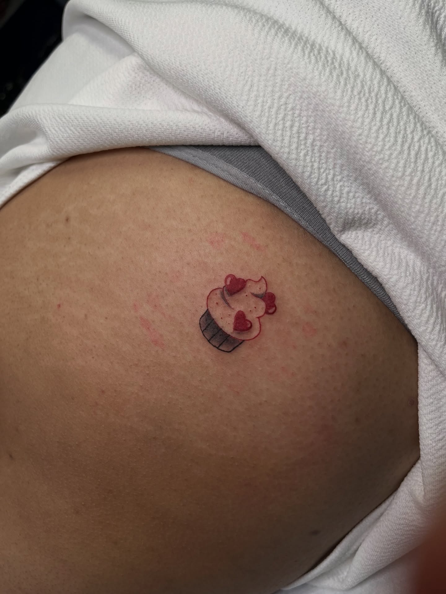 Cupcake dotwork tattoo on the torso by Angie Morales, Laredo, Texas