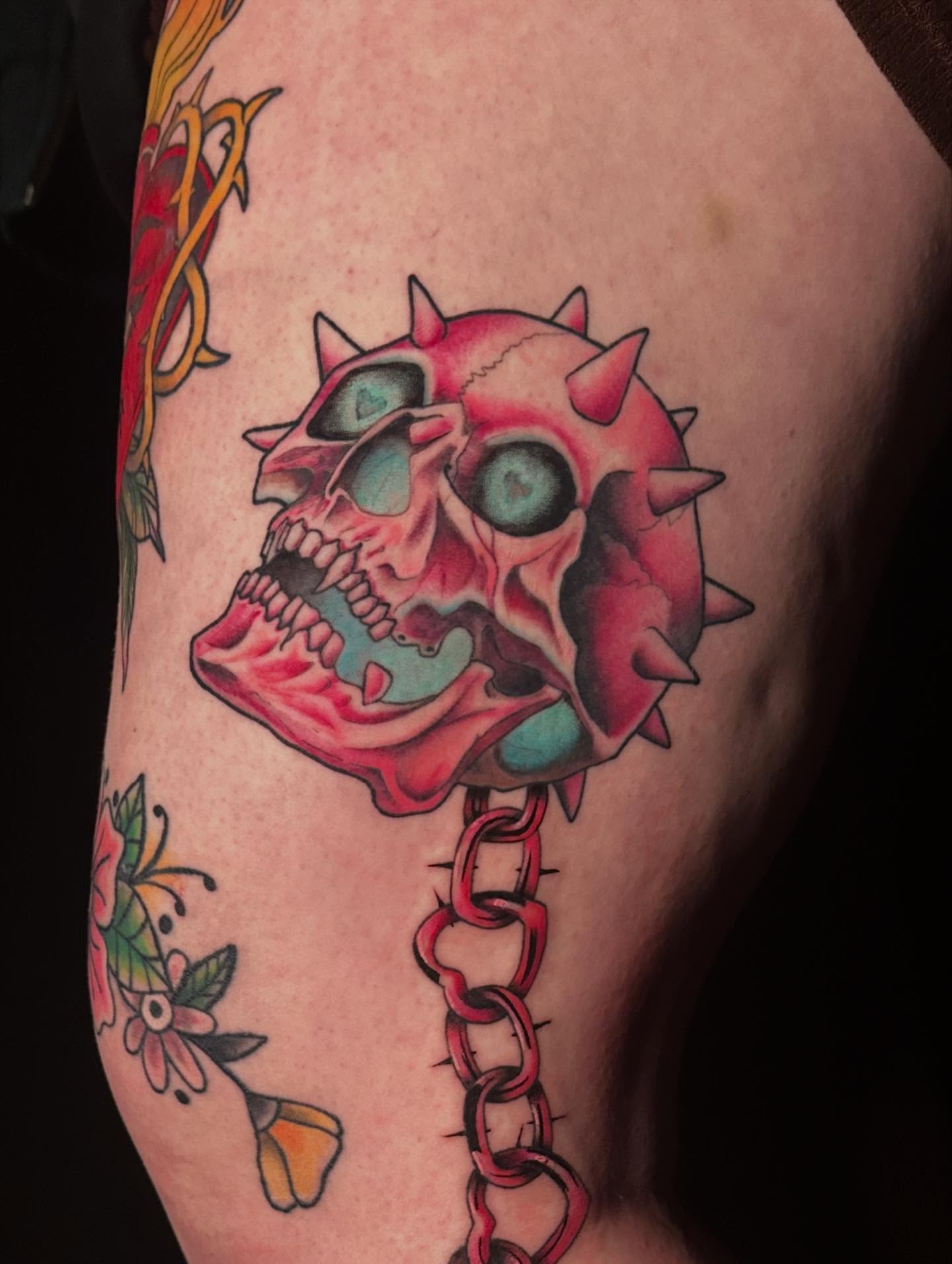 Skull with spikes American traditional tattoo on the thigh by Jack