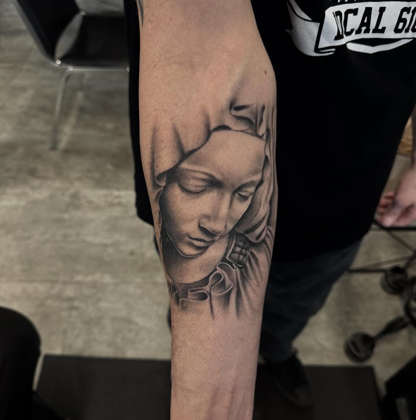 Statue black and grey tattoo on the forearm by Aaron Carey, Salem, Oregon