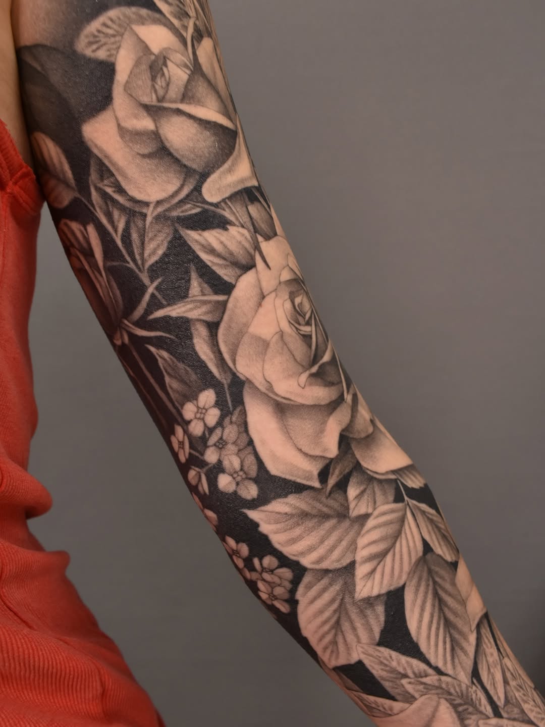 Roses and small flowers dotwork tattoo on the forearm by Tattoo Artist