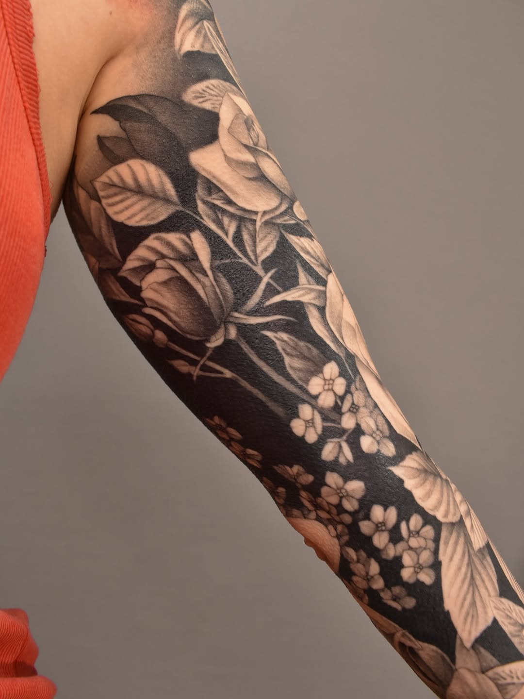 Roses and small flowers Japanese tattoo on the forearm by Tattoo Artist