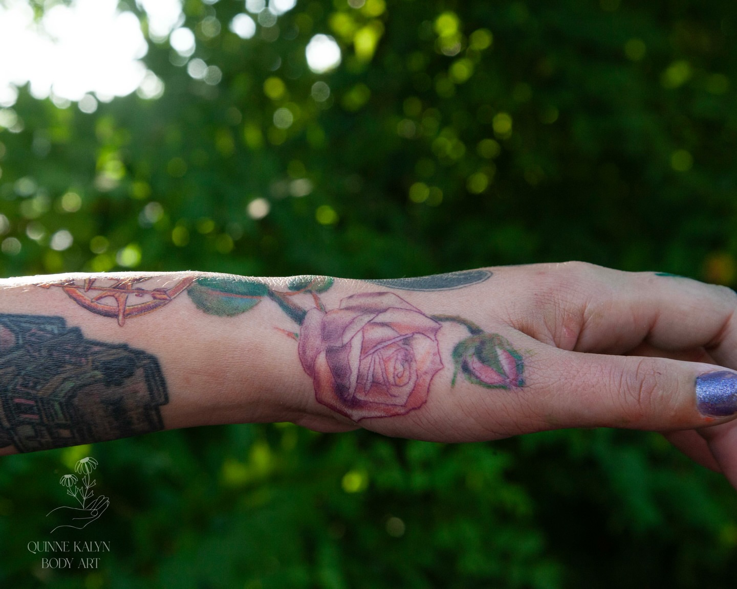 Rose watercolor tattoo on the forearm by Nashville Piercer & Tattoo Artist ✨ Quinne