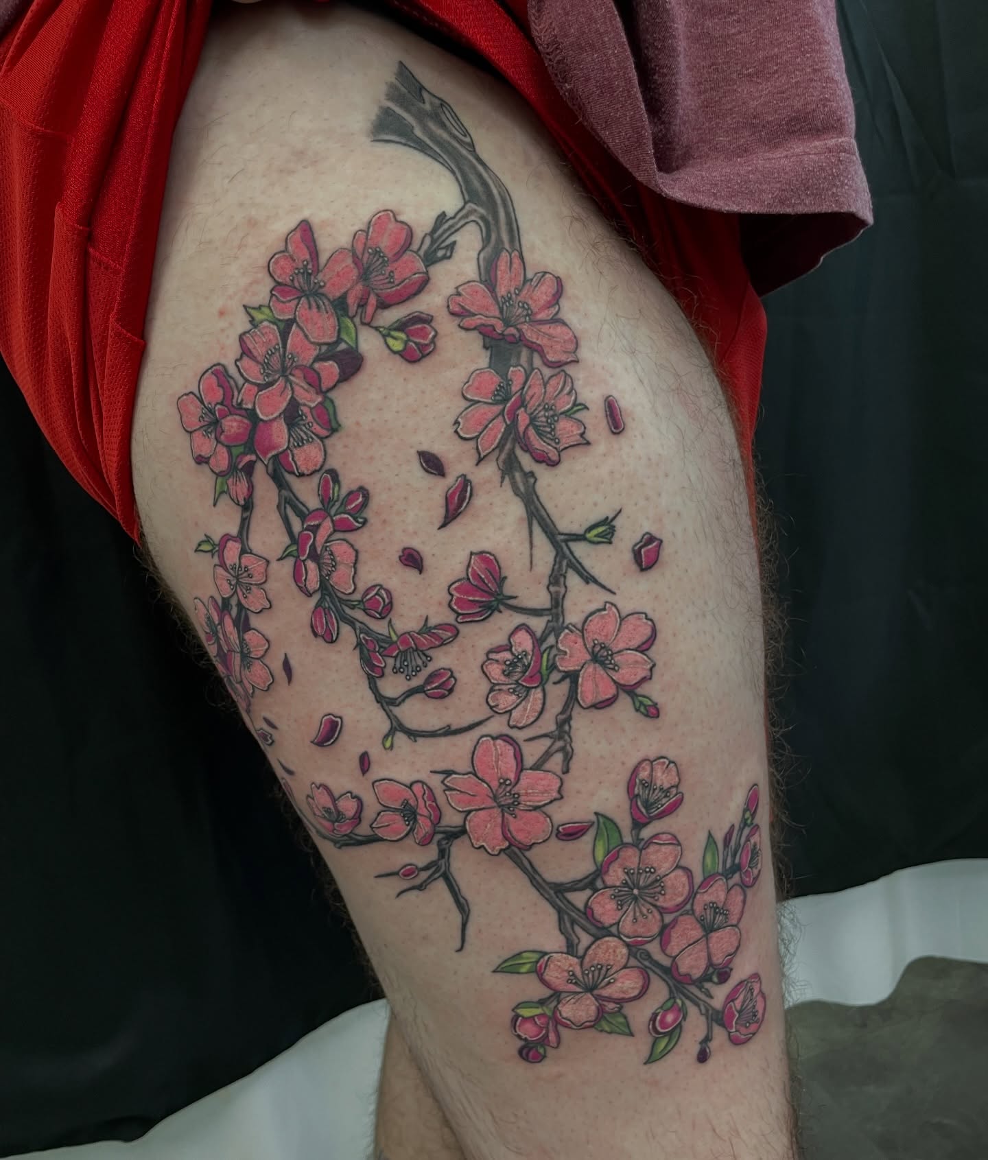 Cherry blossoms dotwork tattoo on the thigh by Joey Taylor