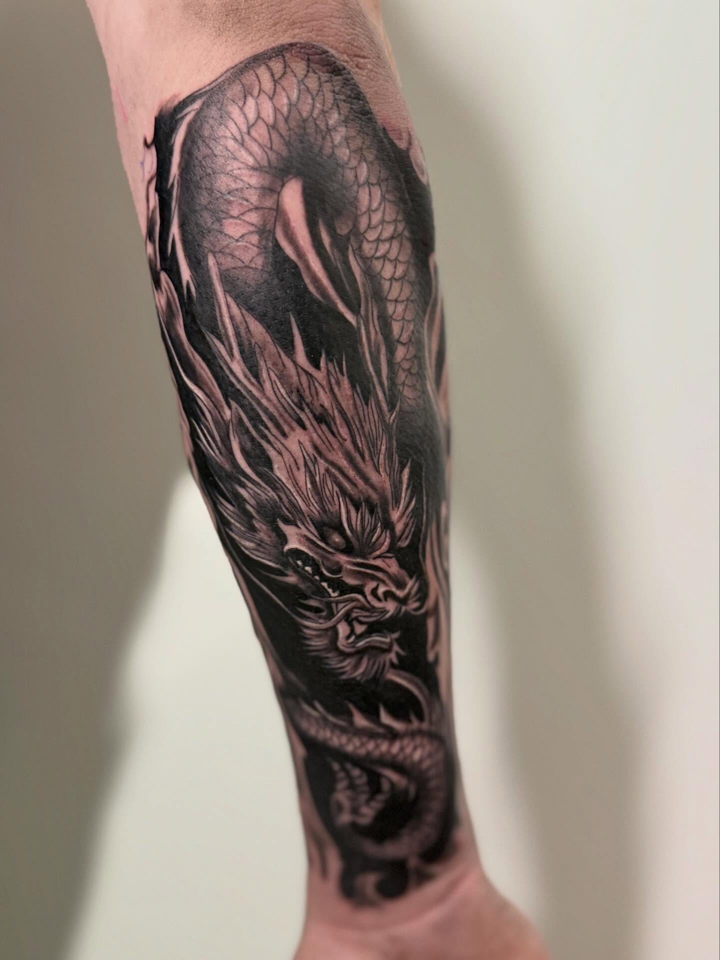 Dragon realism tattoo on the forearm by dotMX