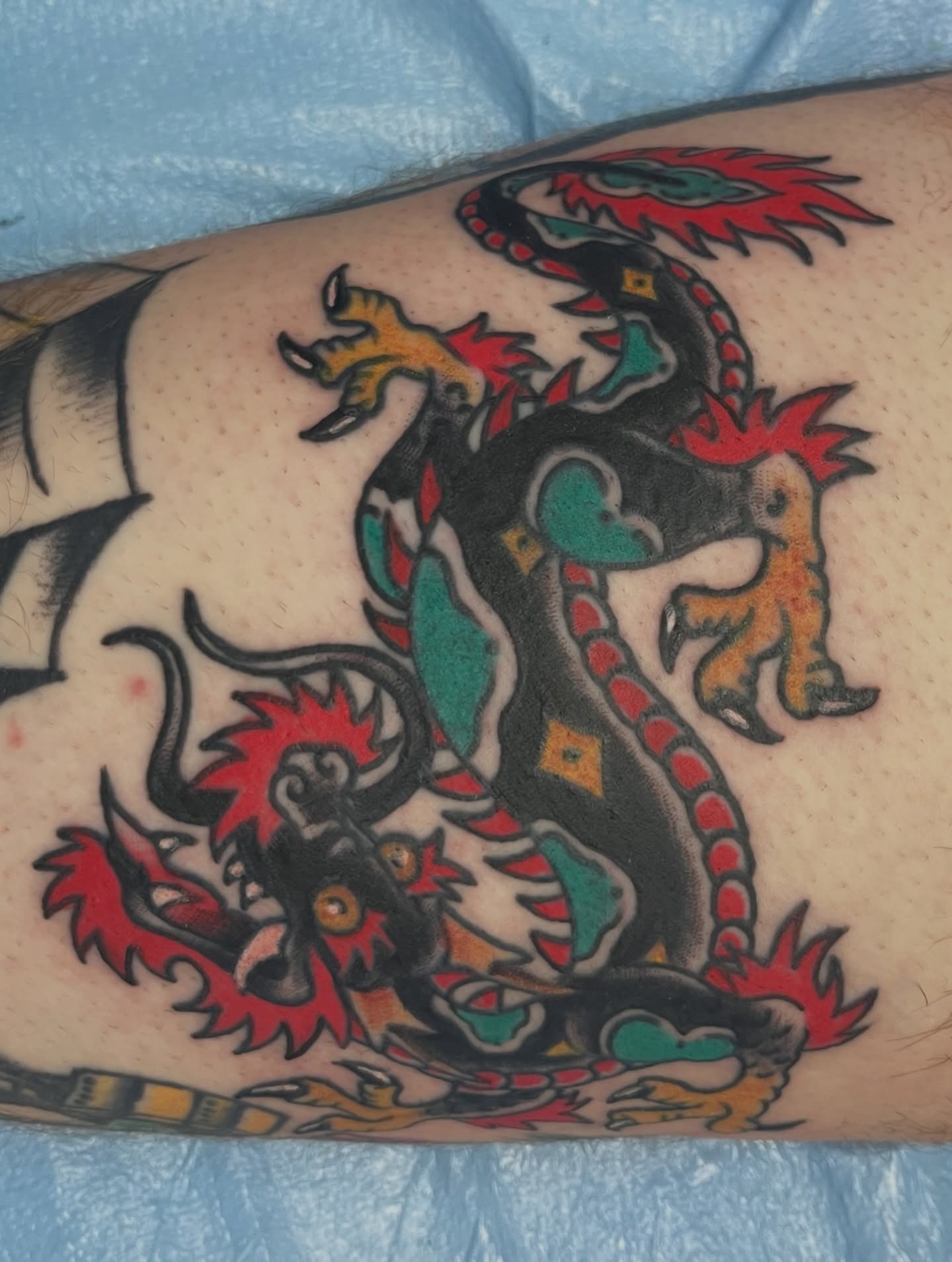 Dragon American traditional tattoo on the forearm by You’ll save me in your phone as Tattoo Tim