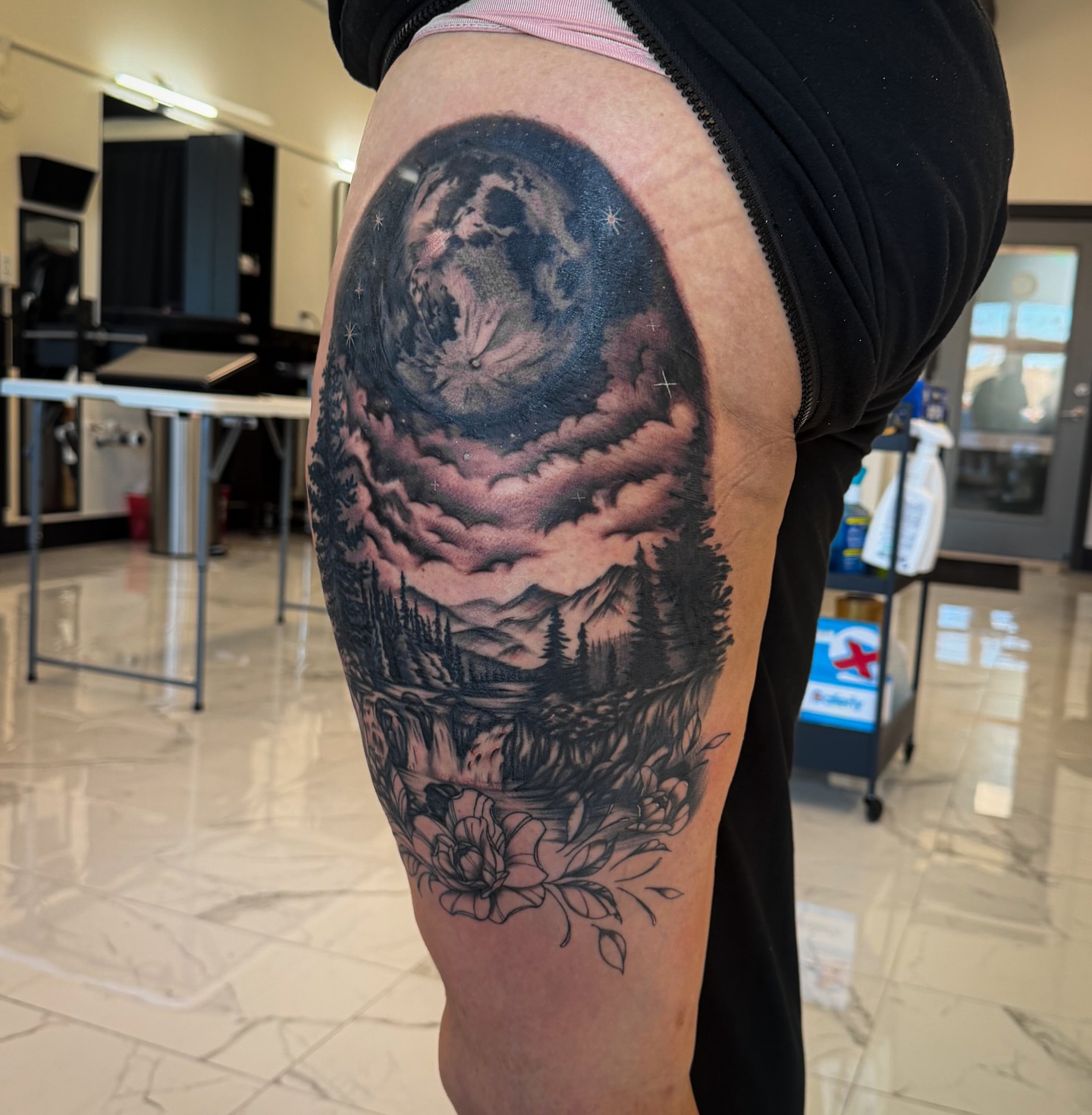 Night sky and landscape realism tattoo on the thigh by utah tattoo artist