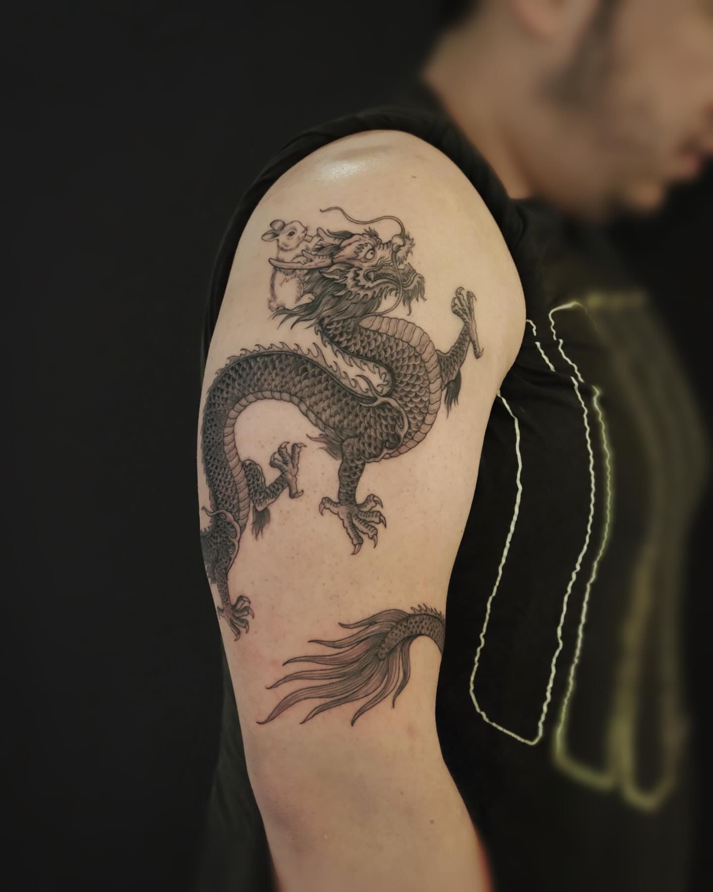 Dragon black and grey tattoo on the shoulder by MJ tattooist