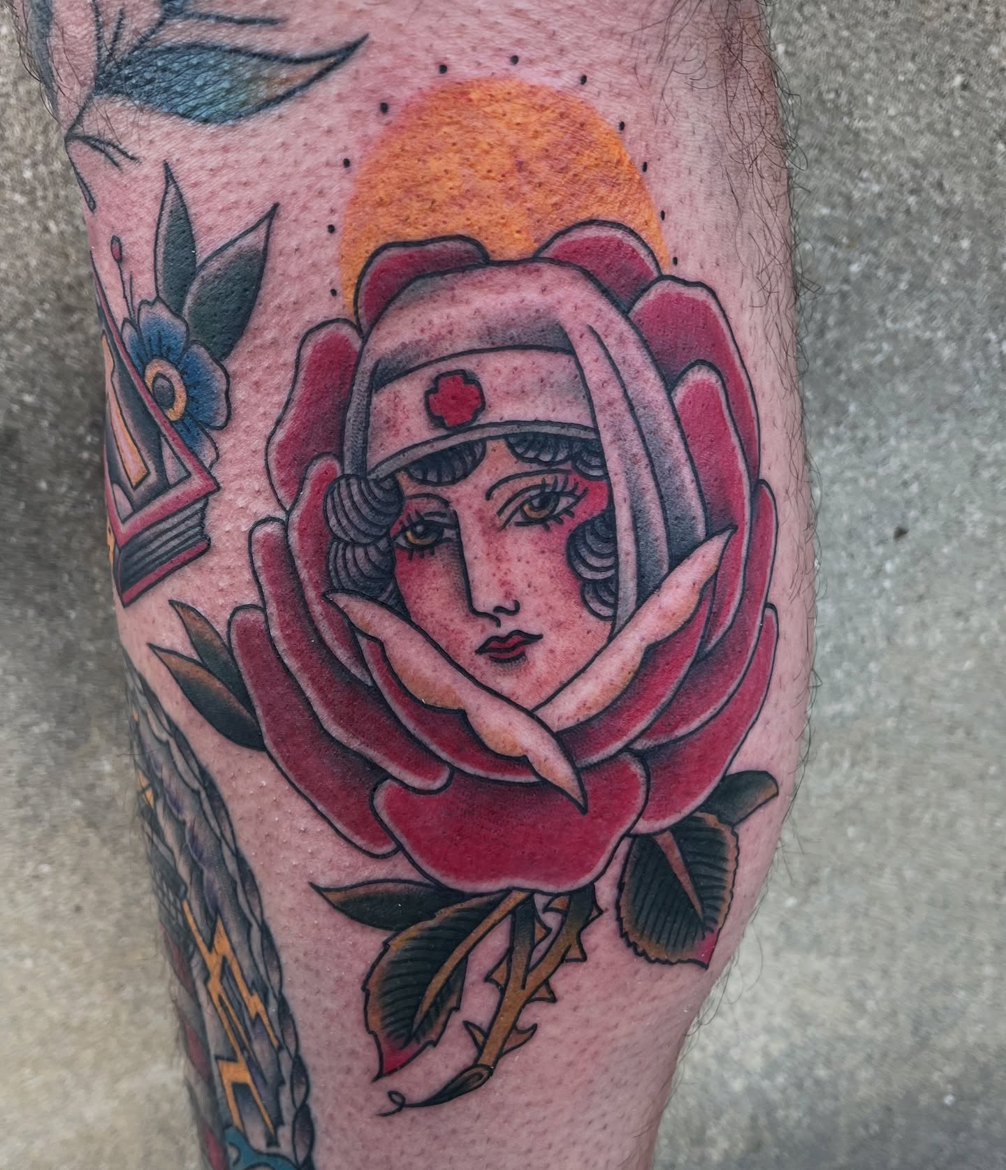 Rose with nurse American traditional tattoo on the forearm by Timmy